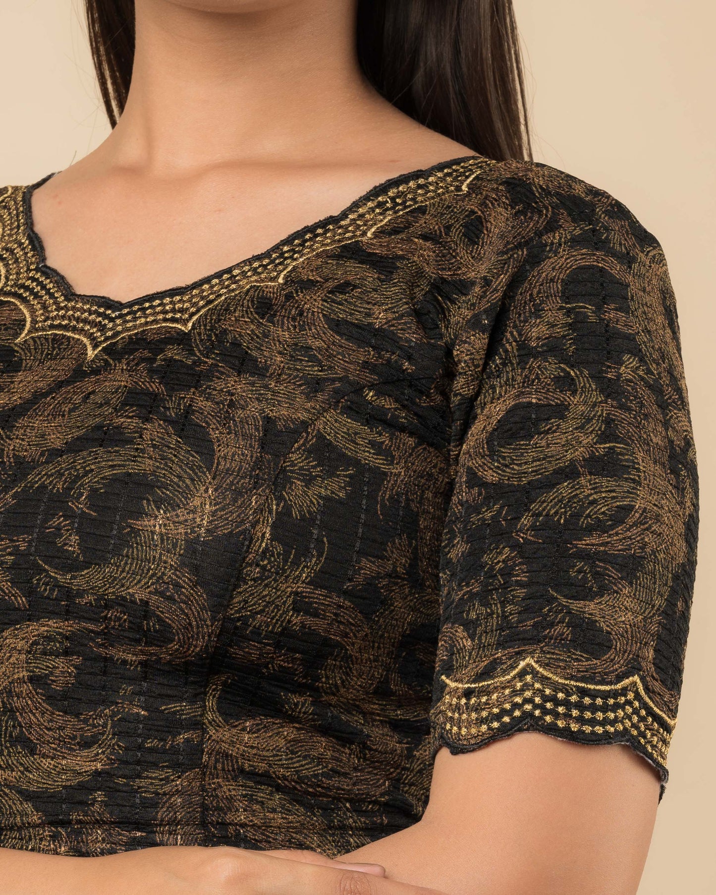 Close-up of the jacquard fabric detailing the texture and zari embroidery of the readymade blouse.