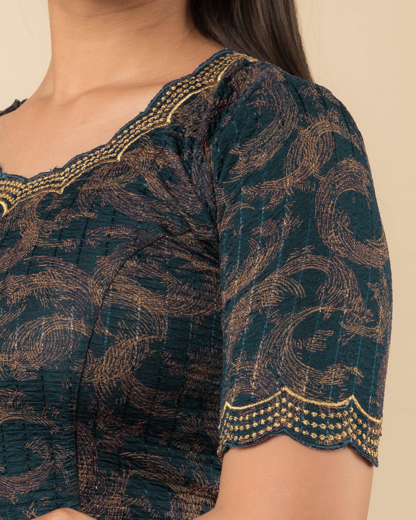Close-up of the jacquard fabric detailing the texture and zari embroidery of the readymade blouse.