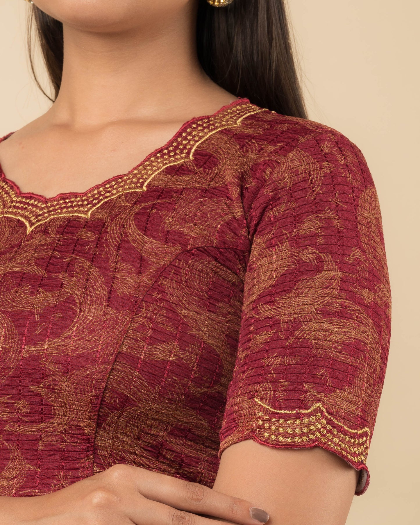 Close-up of the jacquard fabric detailing the texture and zari embroidery of the readymade blouse.
