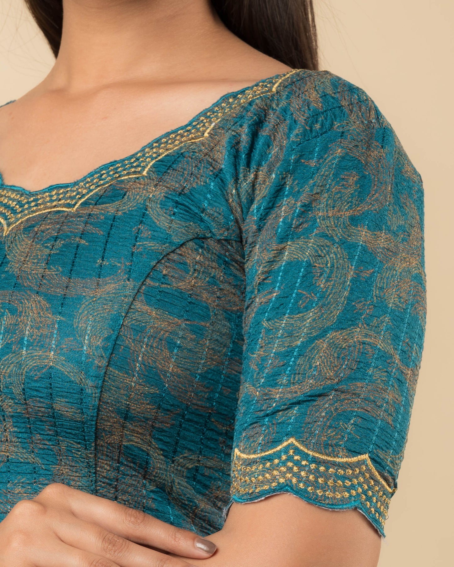 Close-up of the jacquard fabric detailing the texture and zari embroidery of the readymade blouse.