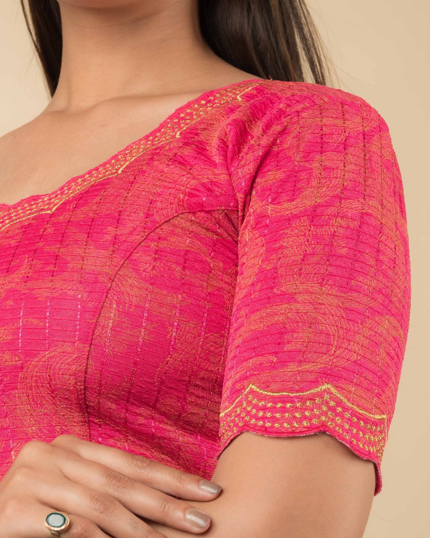 Close-up of the jacquard fabric detailing the texture and zari embroidery of the readymade blouse.