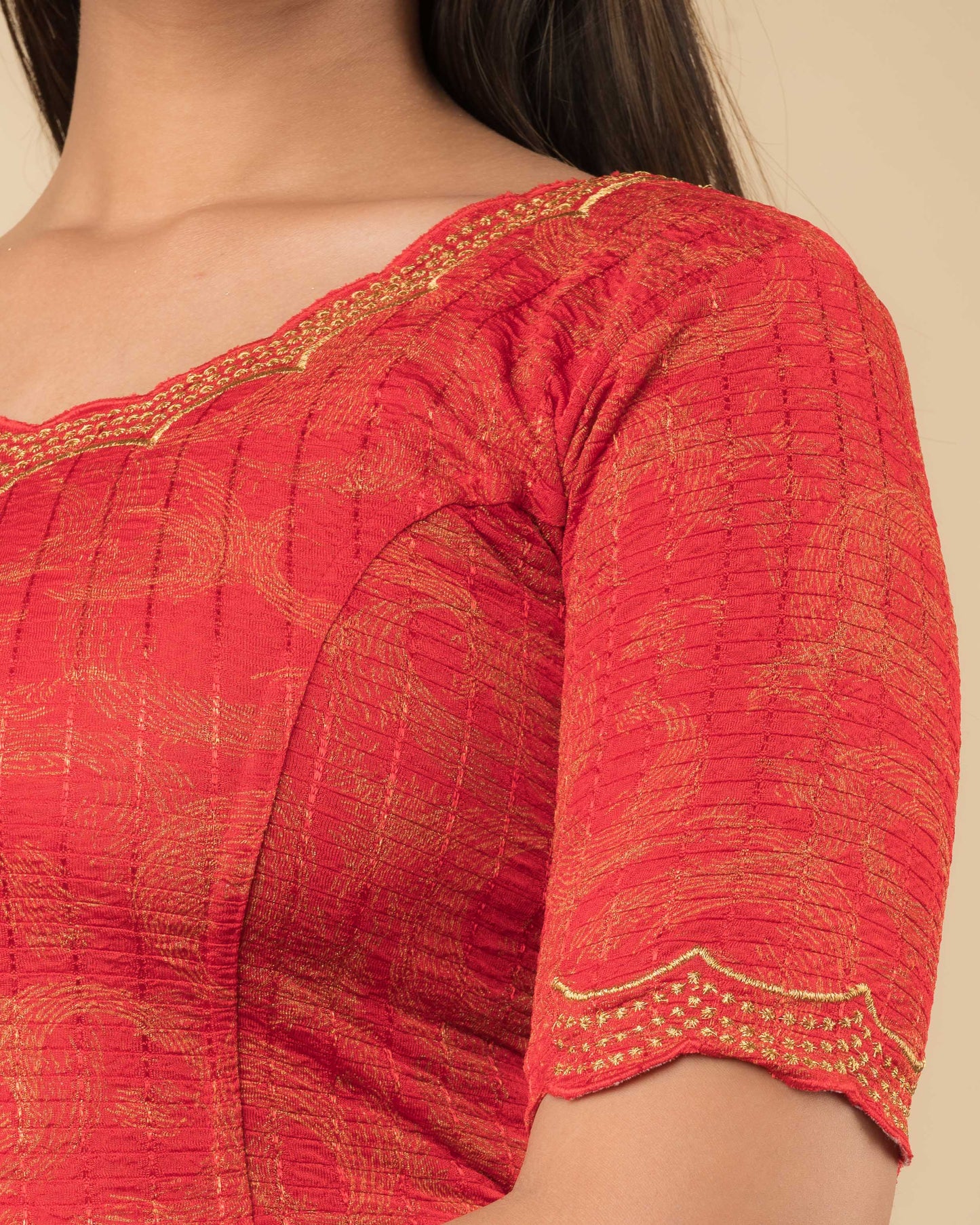 Close-up of the jacquard fabric detailing the texture and zari embroidery of the readymade blouse.