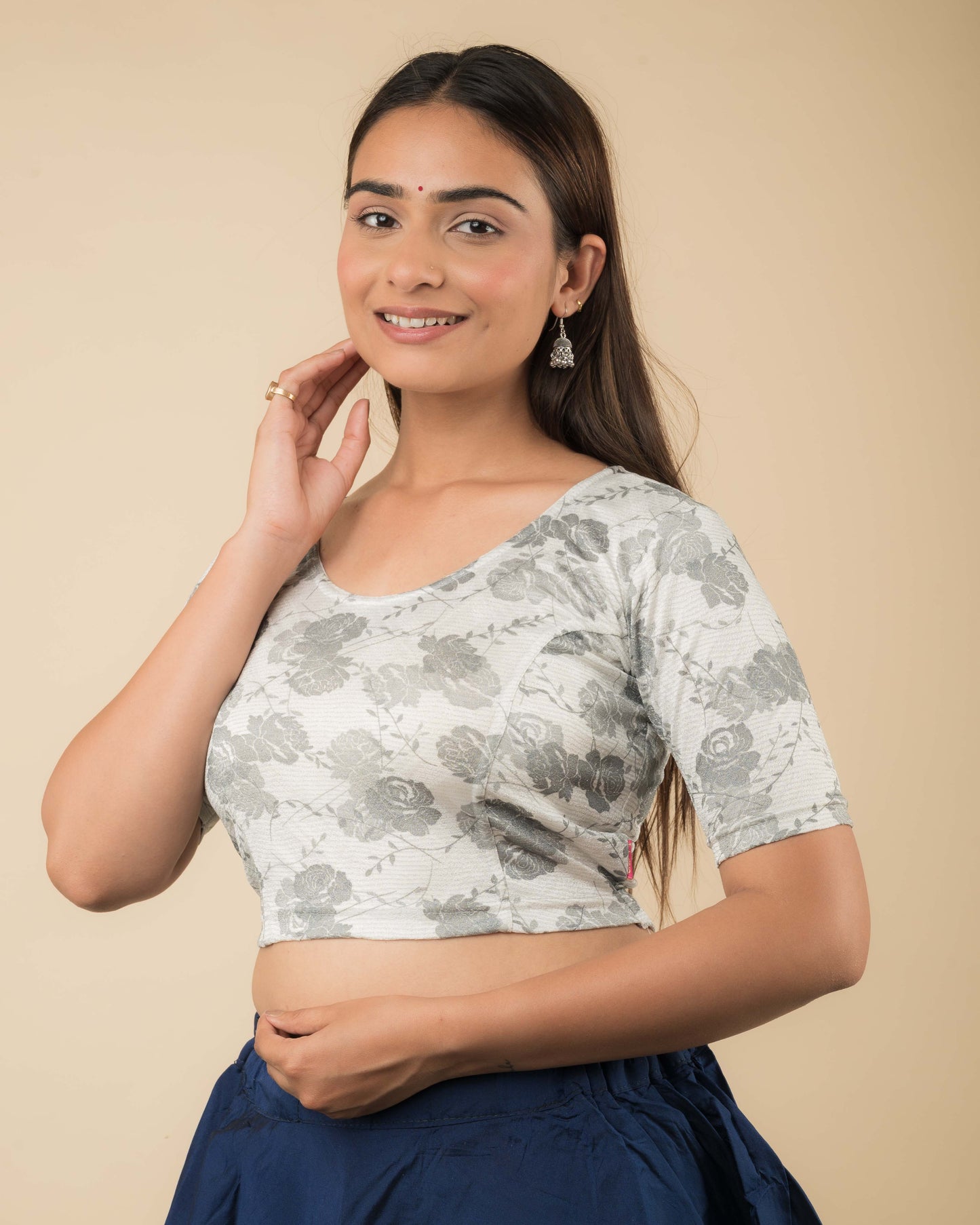 Side profile of the jacquard stretchable blouse highlighting the fit and sleeve length.