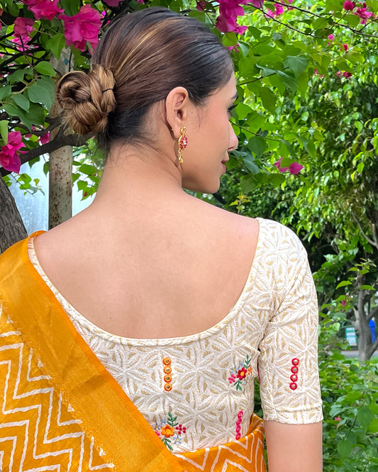 Model pairing the mirror embellished knitted stretchable blouse with a traditional saree, demonstrating a complete ethnic look.