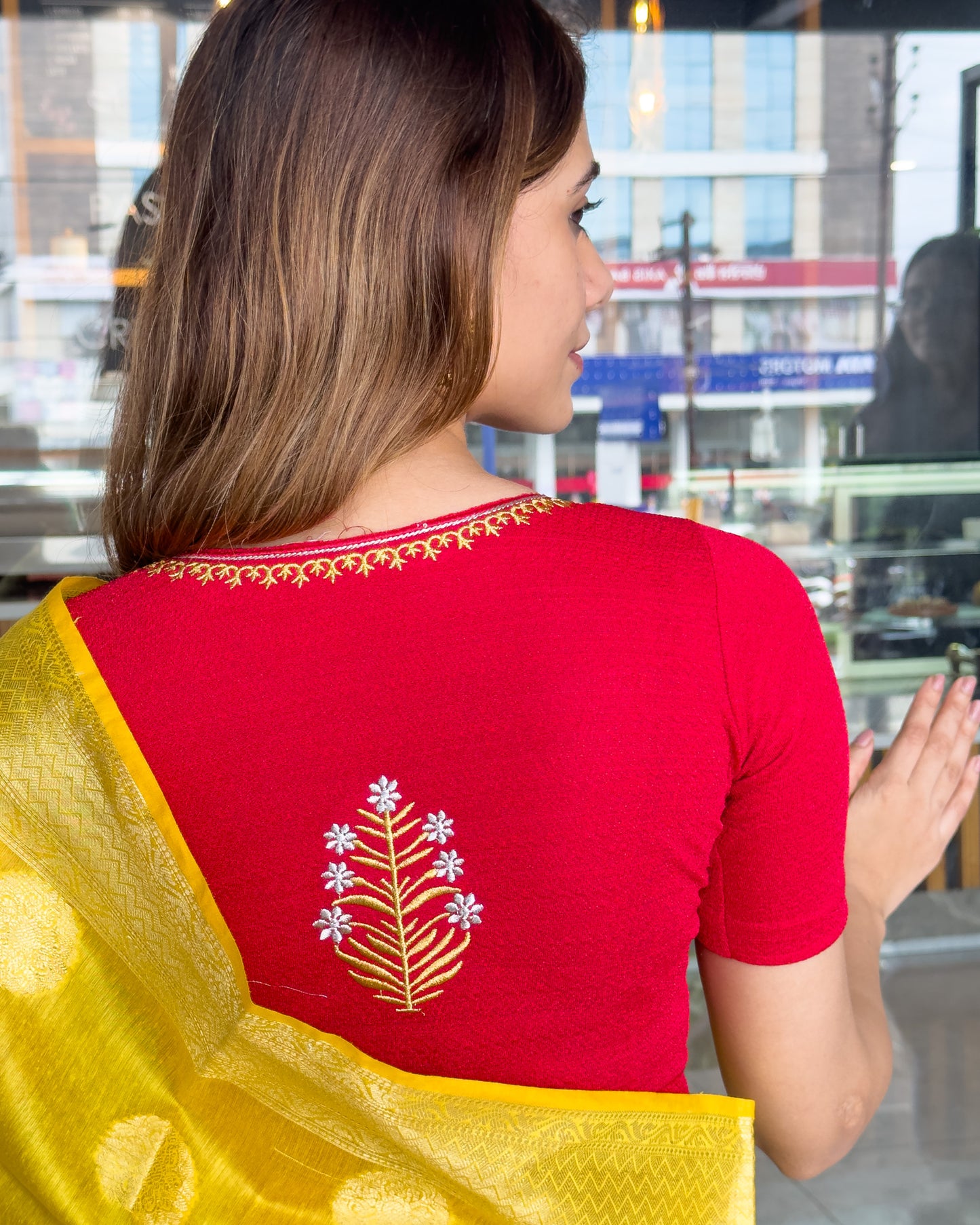 Model pairing the buti embroidered stretchable blouse with a traditional saree, demonstrating a complete ethnic look.