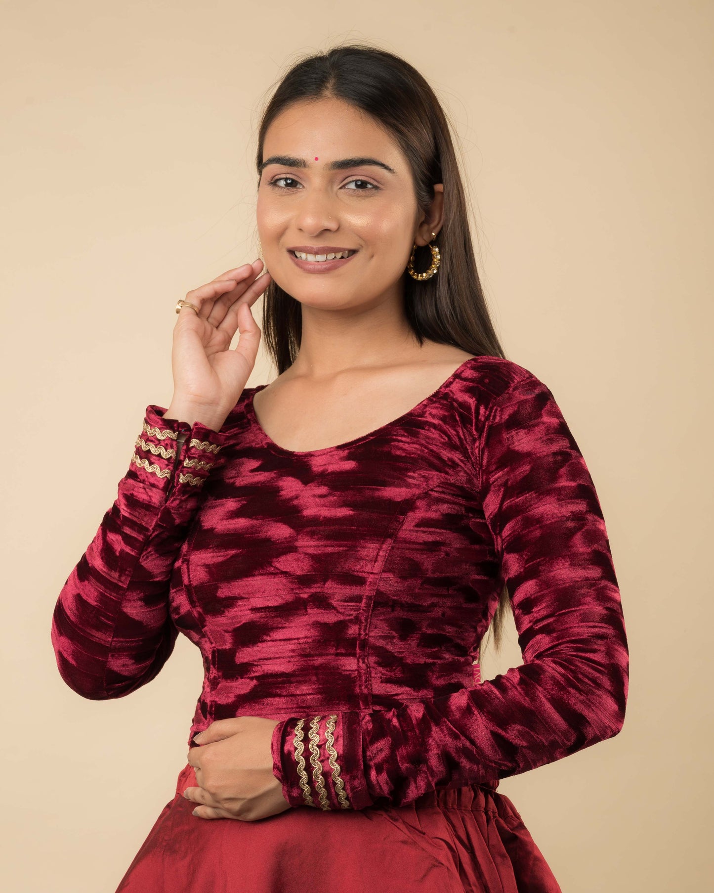 Side profile of the velvet stretchable blouse highlighting the fit and sleeve length.