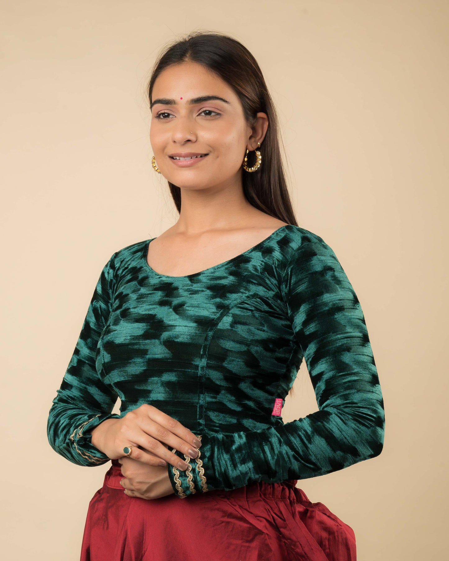 Side profile of the velvet stretchable blouse highlighting the fit and sleeve length.