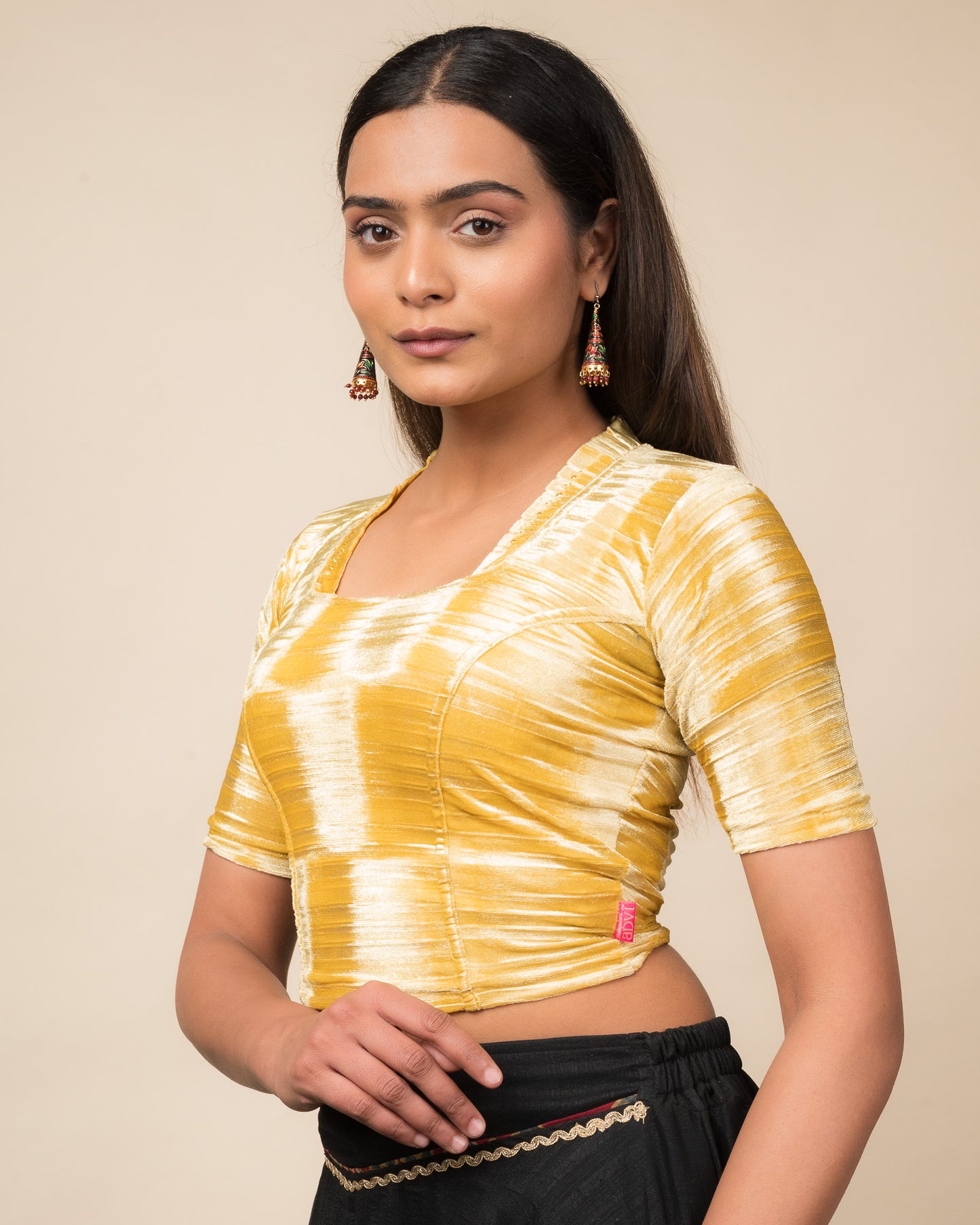 Side profile of the velvet stretchable blouse highlighting the fit and sleeve length.