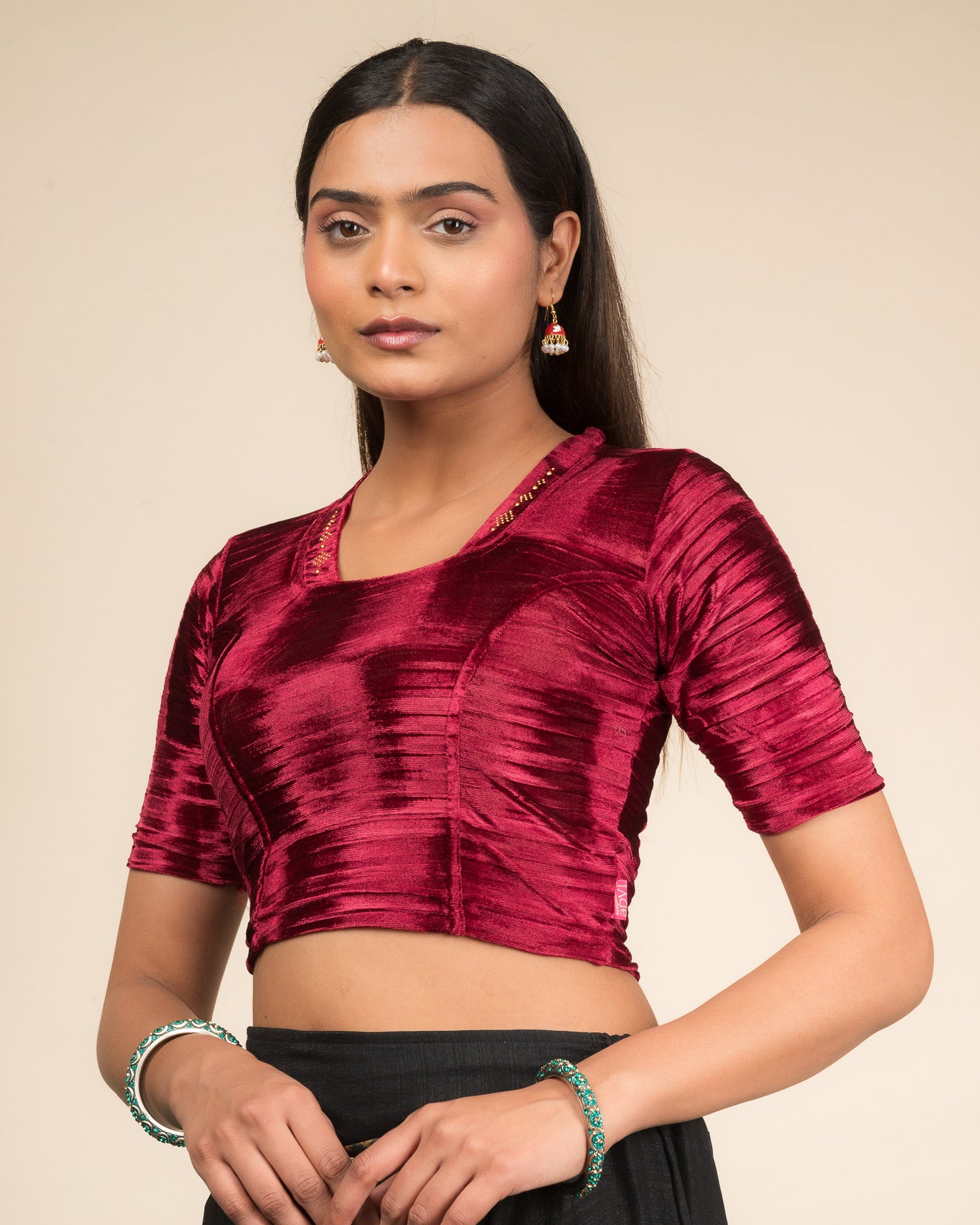 Side profile of the velvet stretchable blouse highlighting the fit and sleeve length.