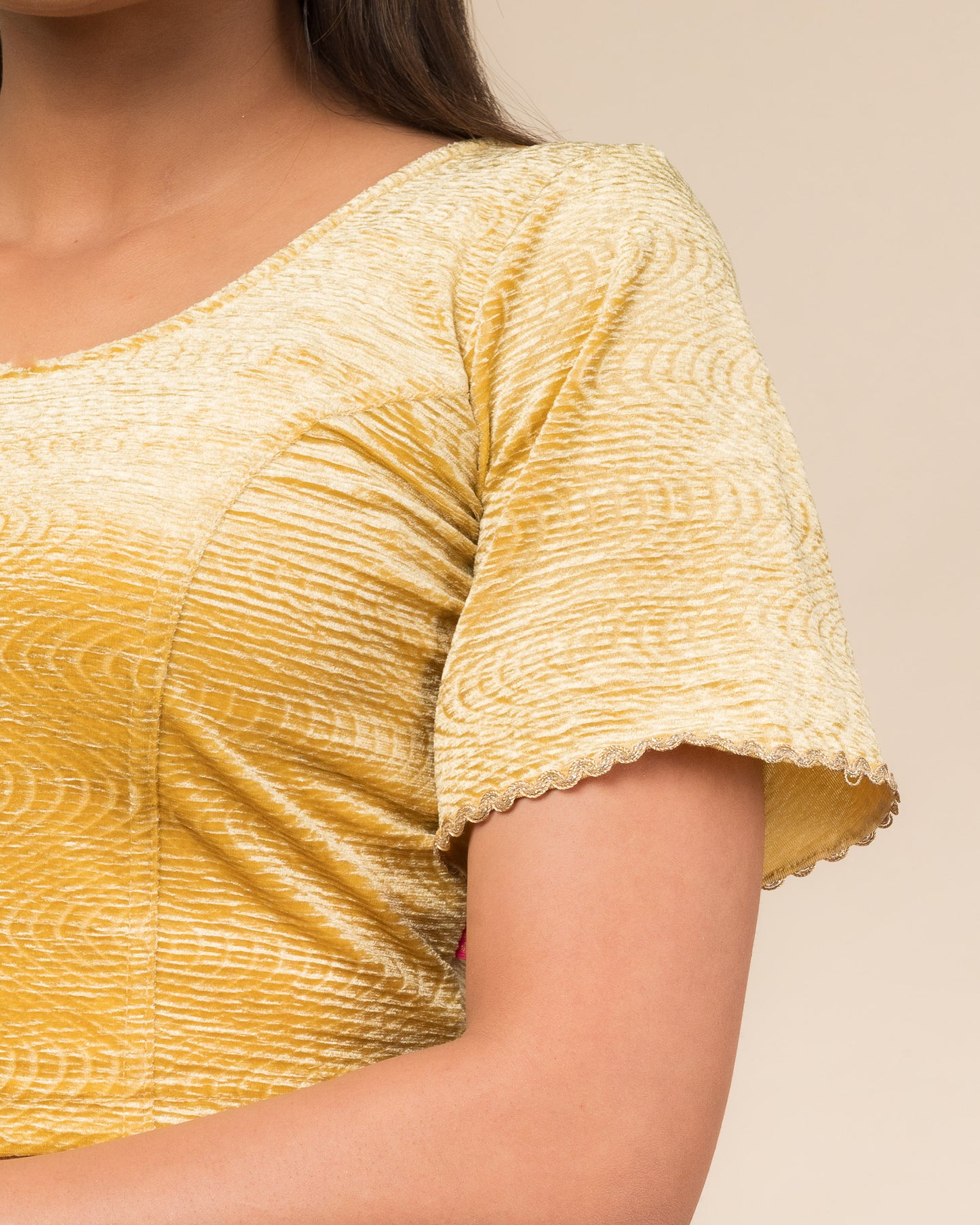 Close-up of the velvet fabric detailing the lace embroidery and stretchability of the readymade blouse.