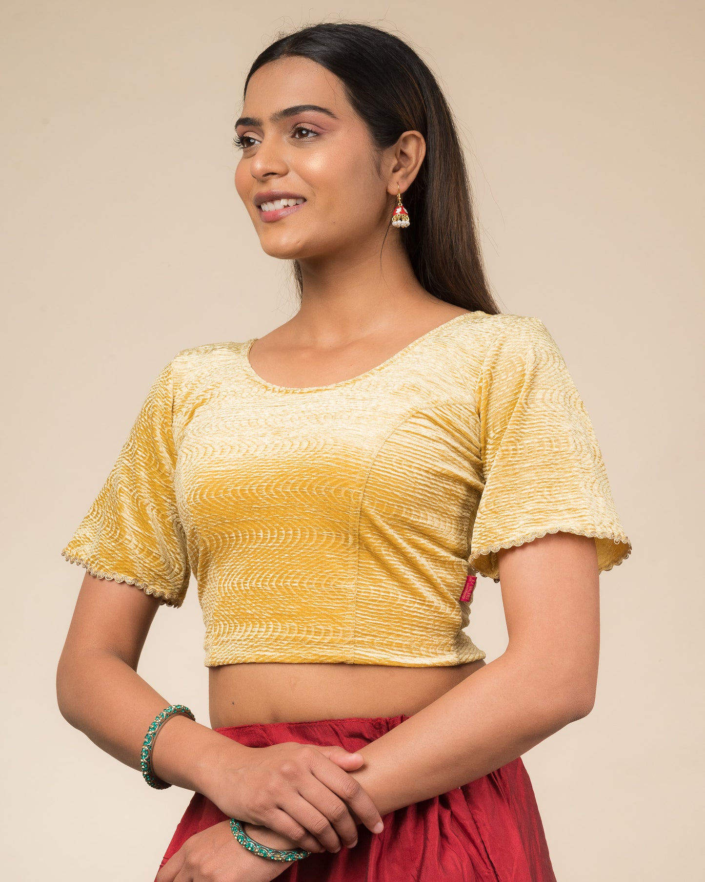 Side profile of the velvet stretchable blouse highlighting the fit and sleeve length.