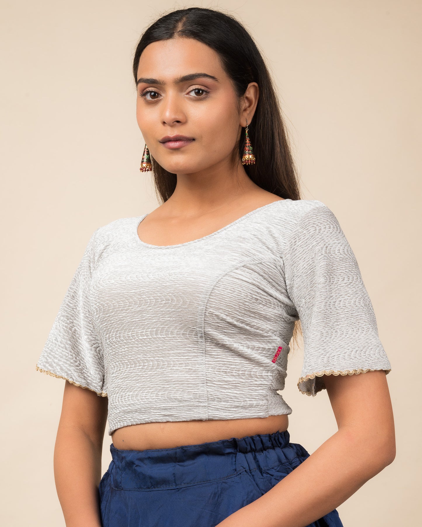 Side profile of the velvet stretchable blouse highlighting the fit and sleeve length.