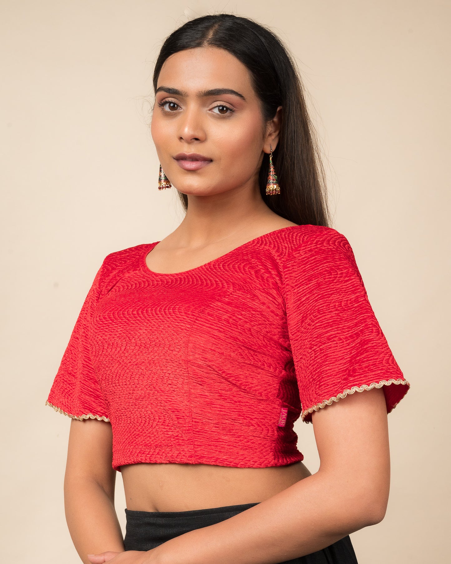 Side profile of the velvet stretchable blouse highlighting the fit and sleeve length.