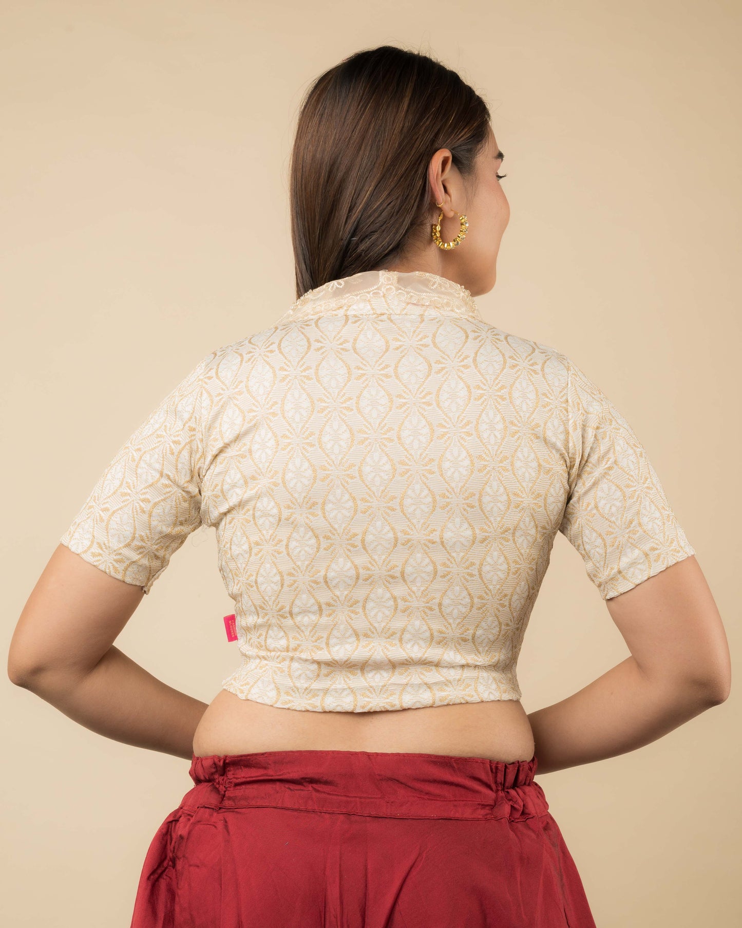 Rear view showcasing the collar’s embroidery and back design.