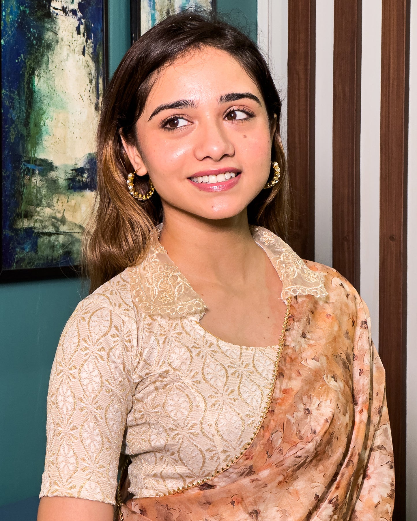 Model pairing the blouse with a saree for a festive-ready ensemble.