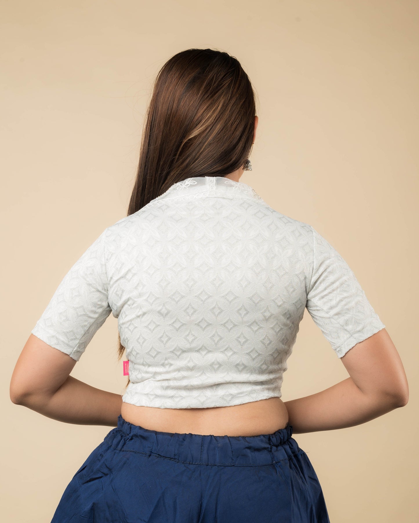 Rear view showcasing the collar’s embroidery and back design.