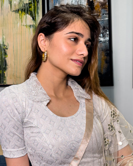 Model pairing the blouse with a saree for a festive-ready ensemble.