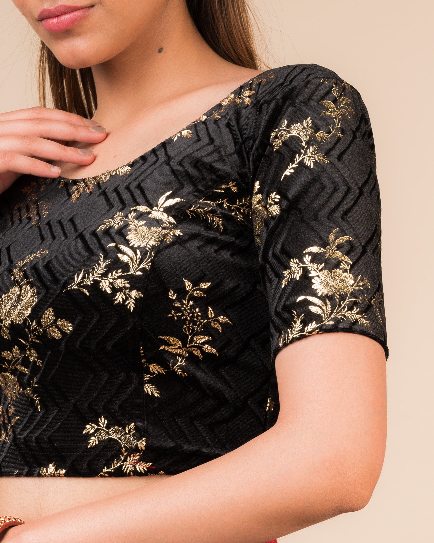 Close-up of the velvet fabric highlighting the metallic foil floral texture.