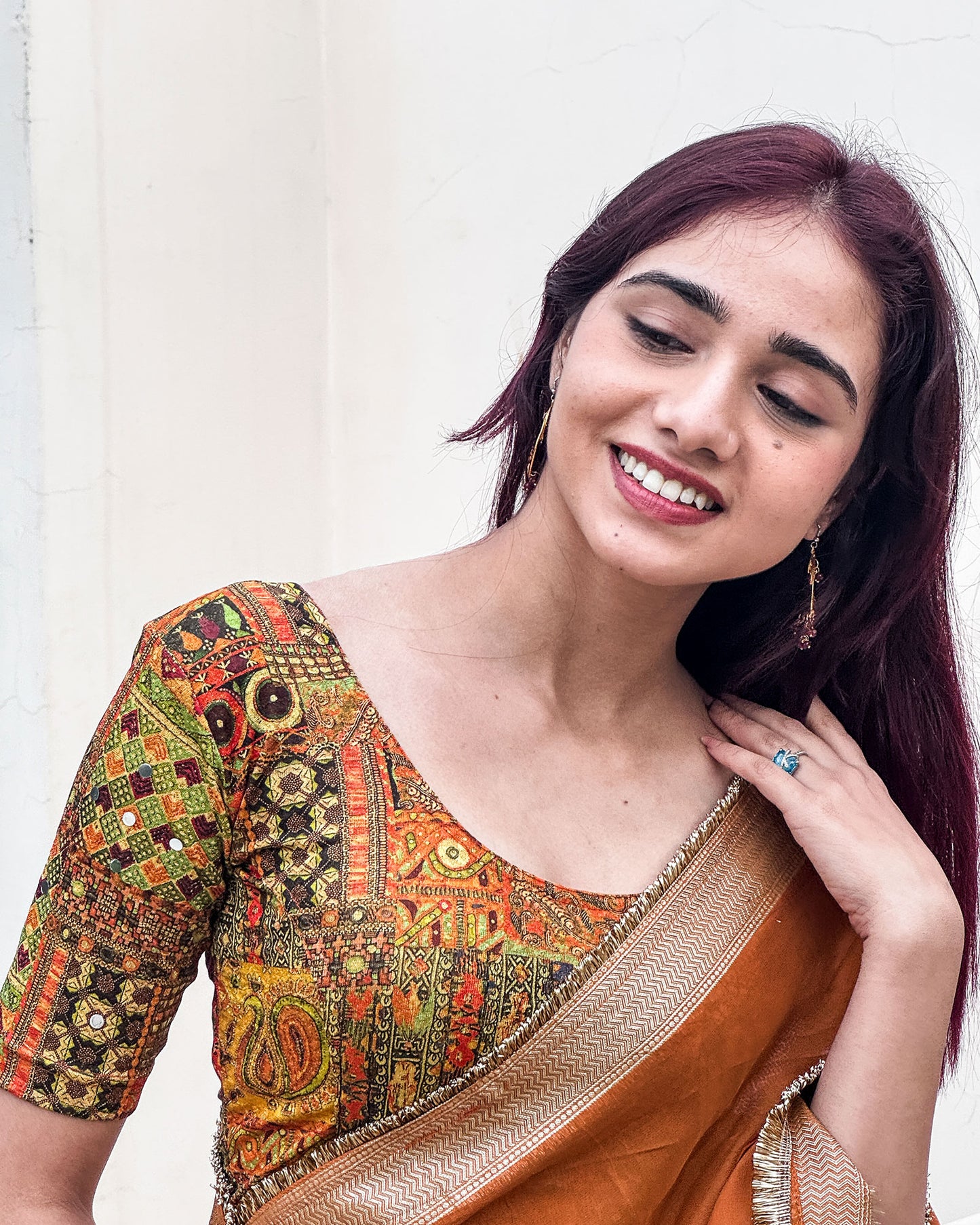 Model pairing the blouse with a saree or lehenga for an ethnic fusion look.