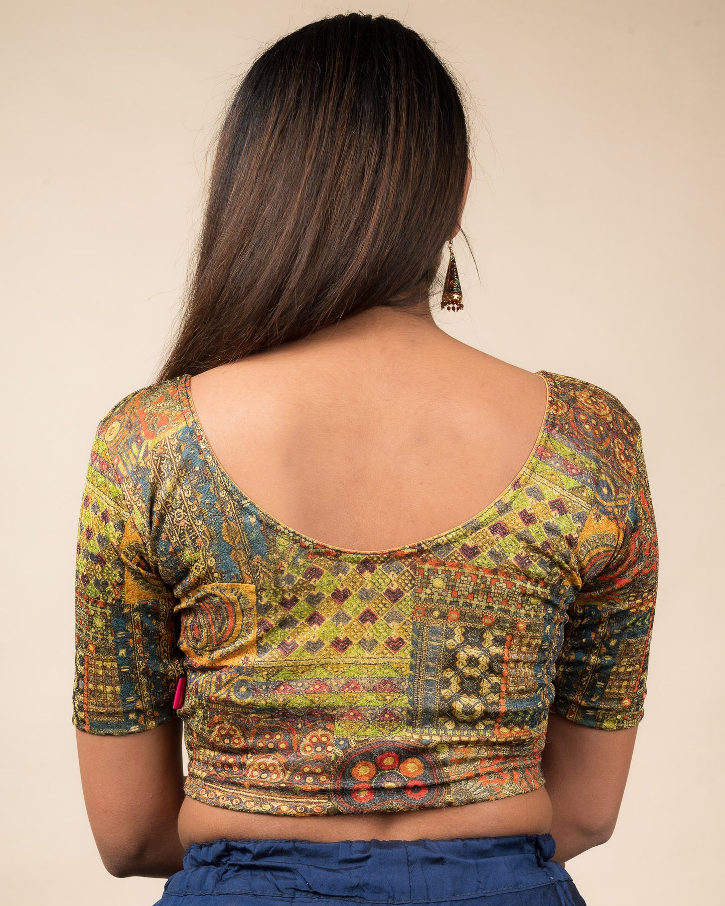 Rear view showcasing the blouse’s back design.