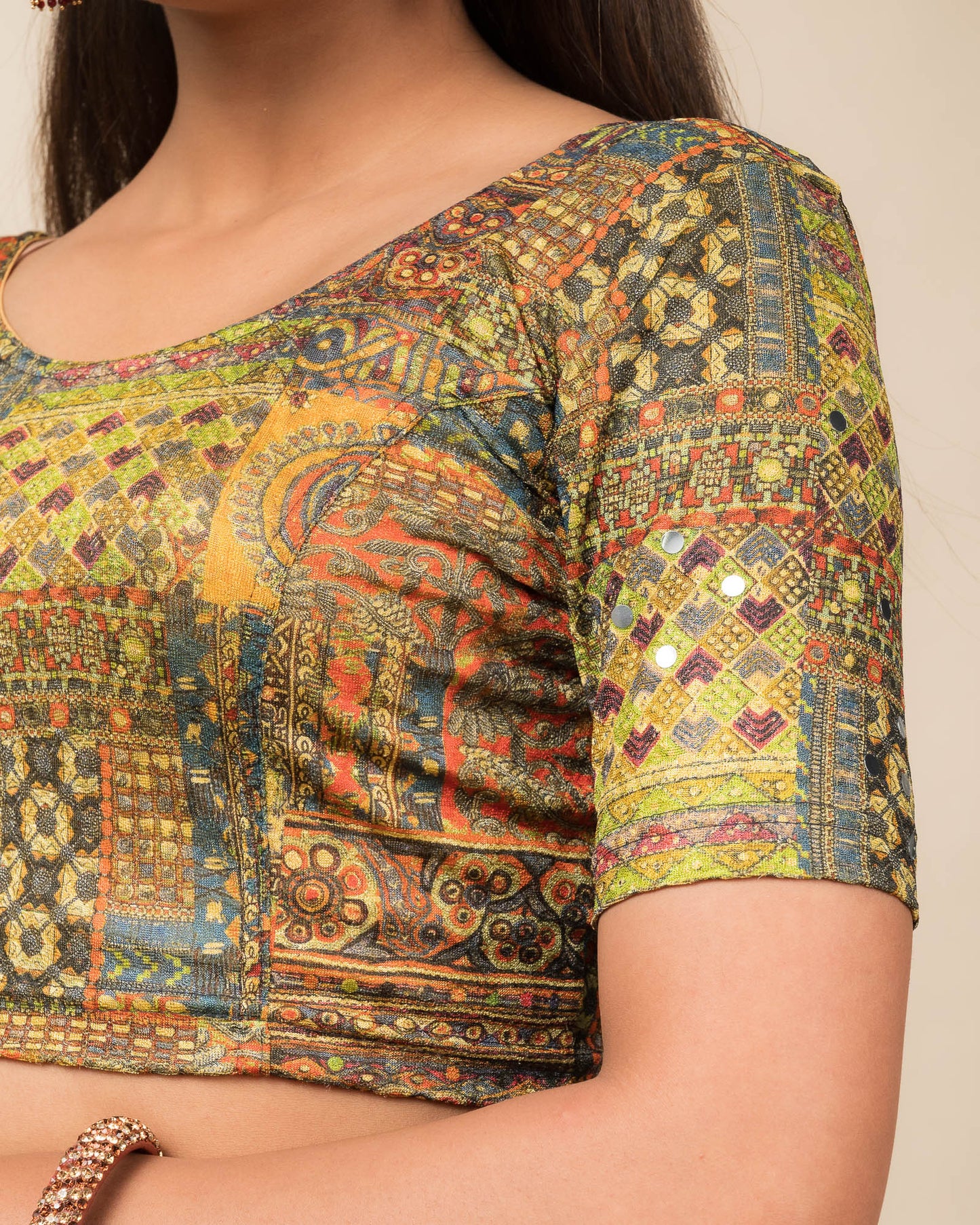 Close-up of the jacquard knit fabric with mirror and printed detailing.