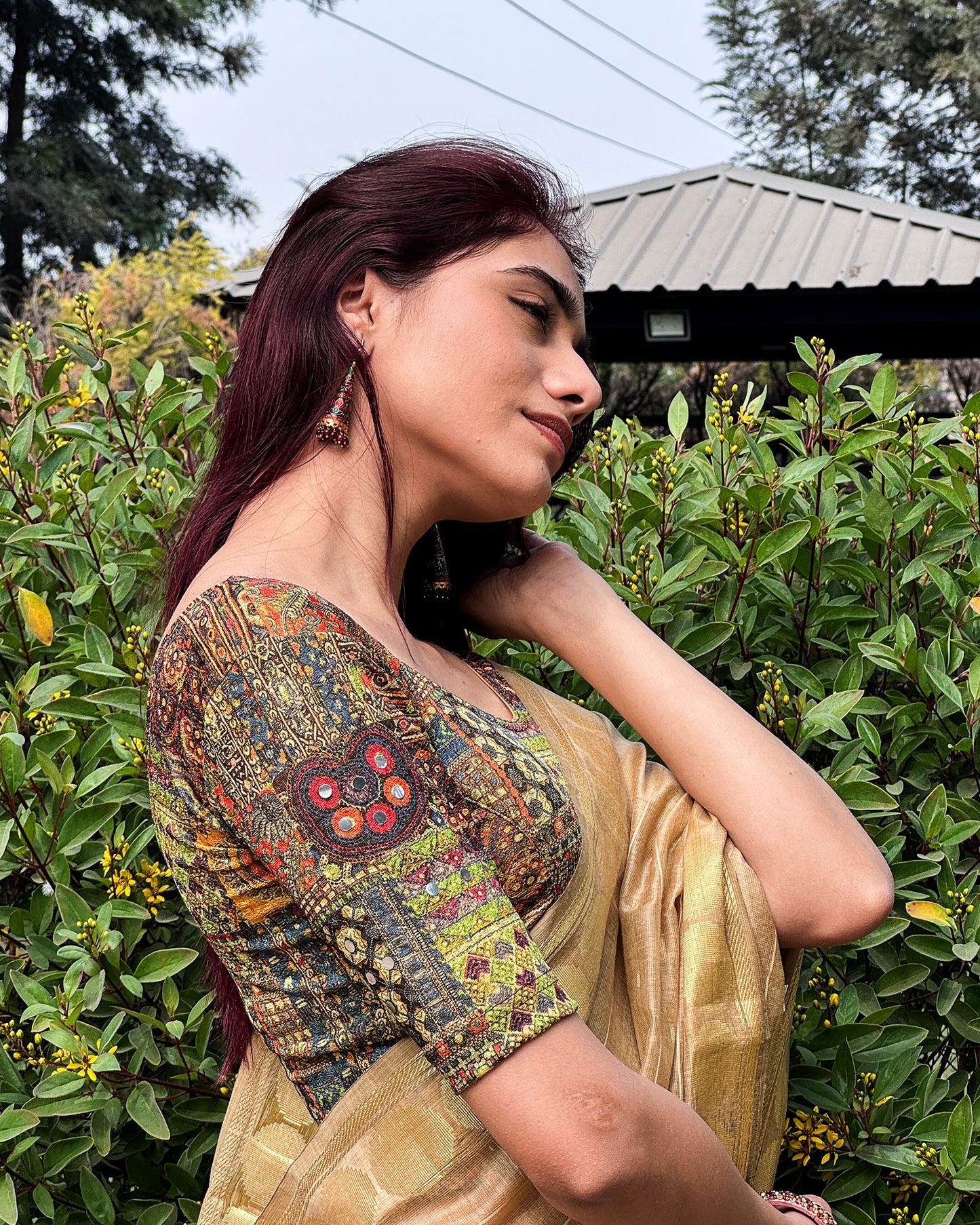 Model pairing the blouse with a saree or lehenga for an ethnic fusion look.