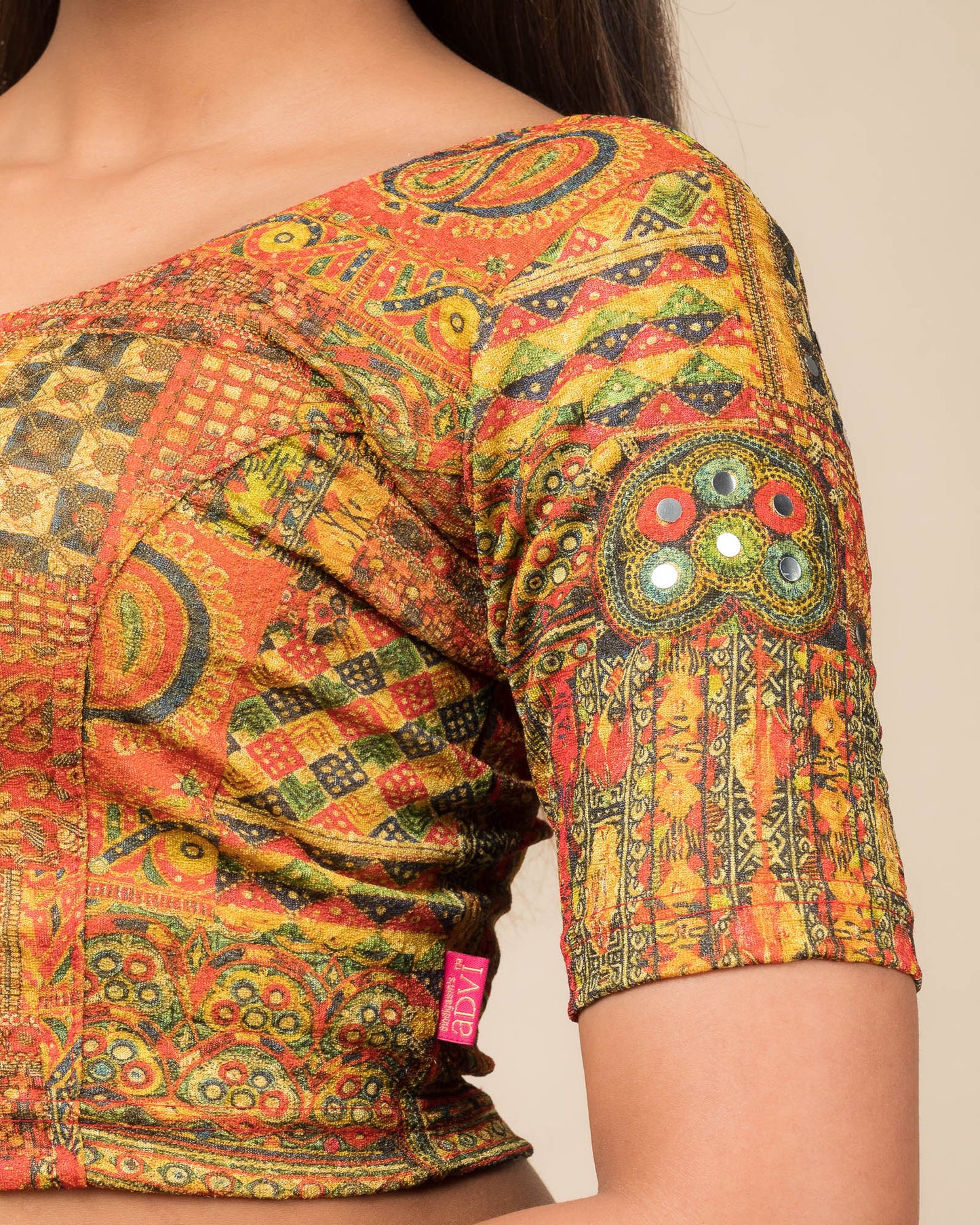 Close-up of the jacquard knit fabric with mirror and printed detailing.
