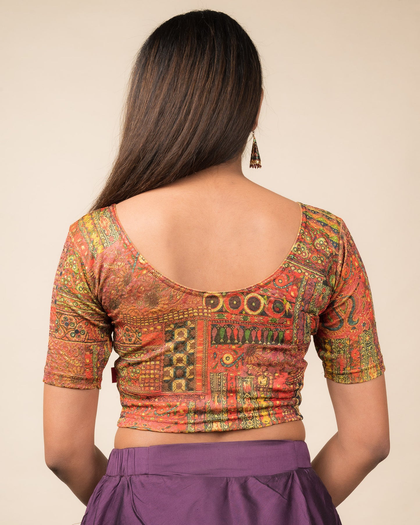 Rear view showcasing the blouse’s back design.