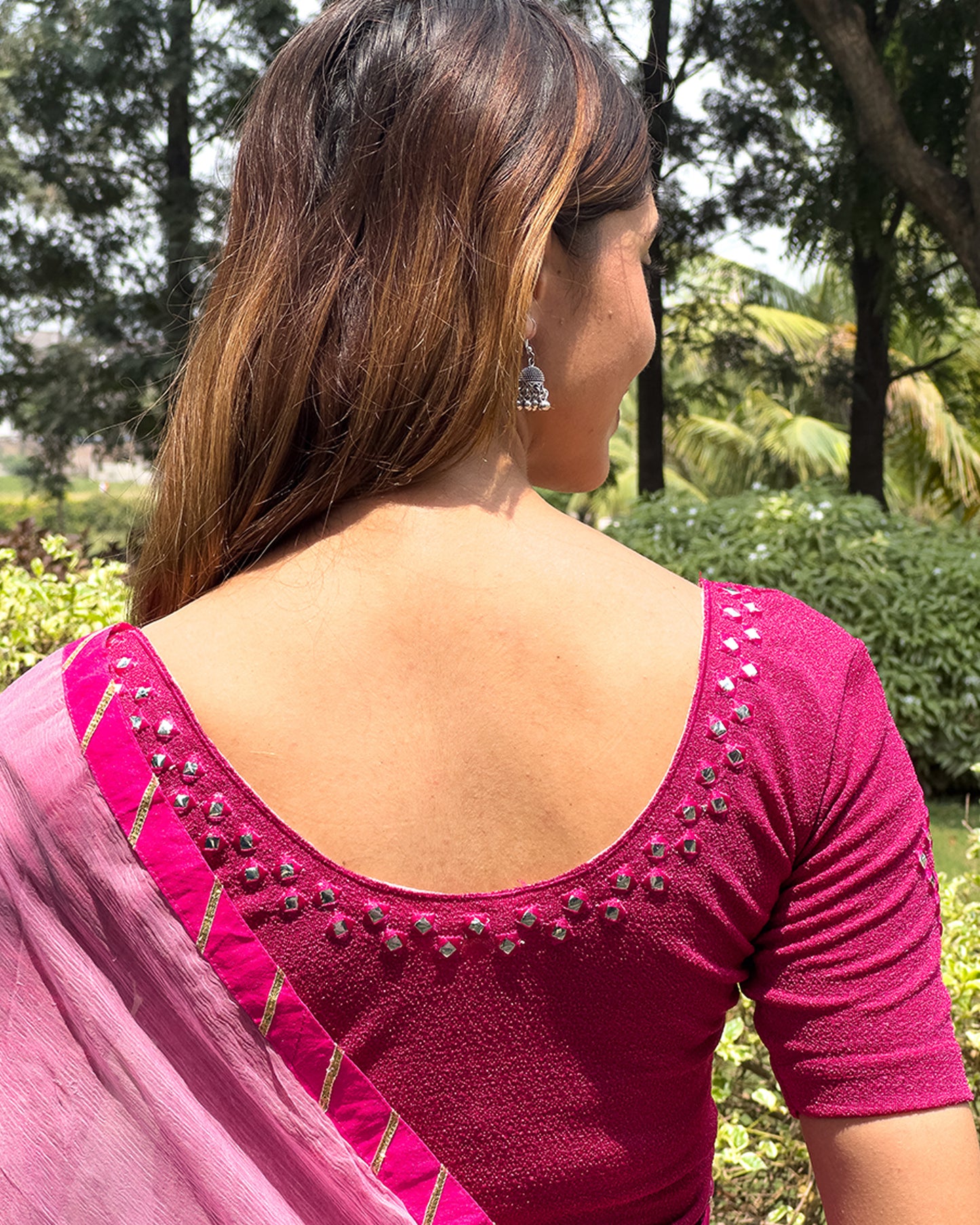 Rear view of the blouse showcasing the back design.