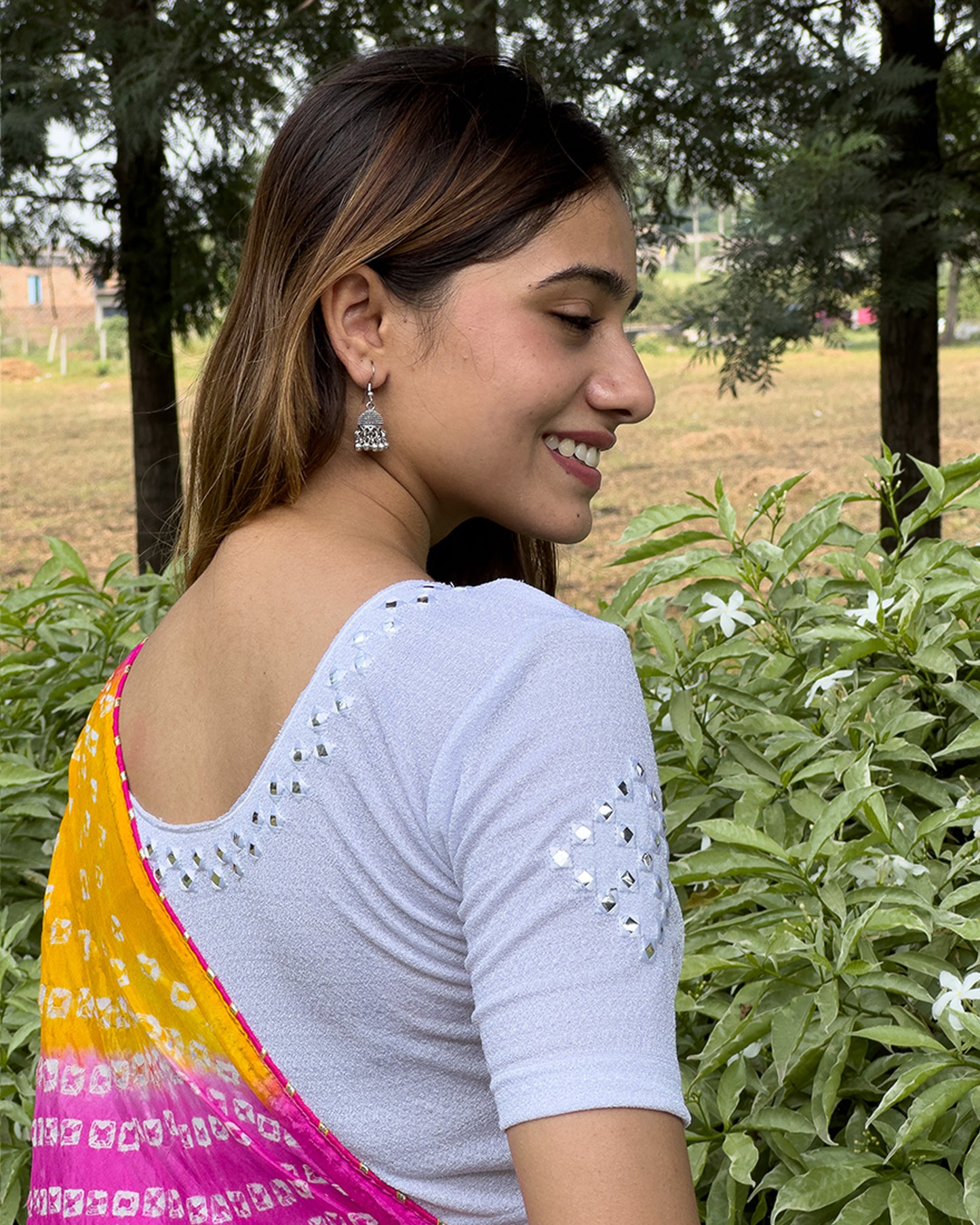 Model wearing the blouse with a saree for a festive ensemble ideal for Navratri.