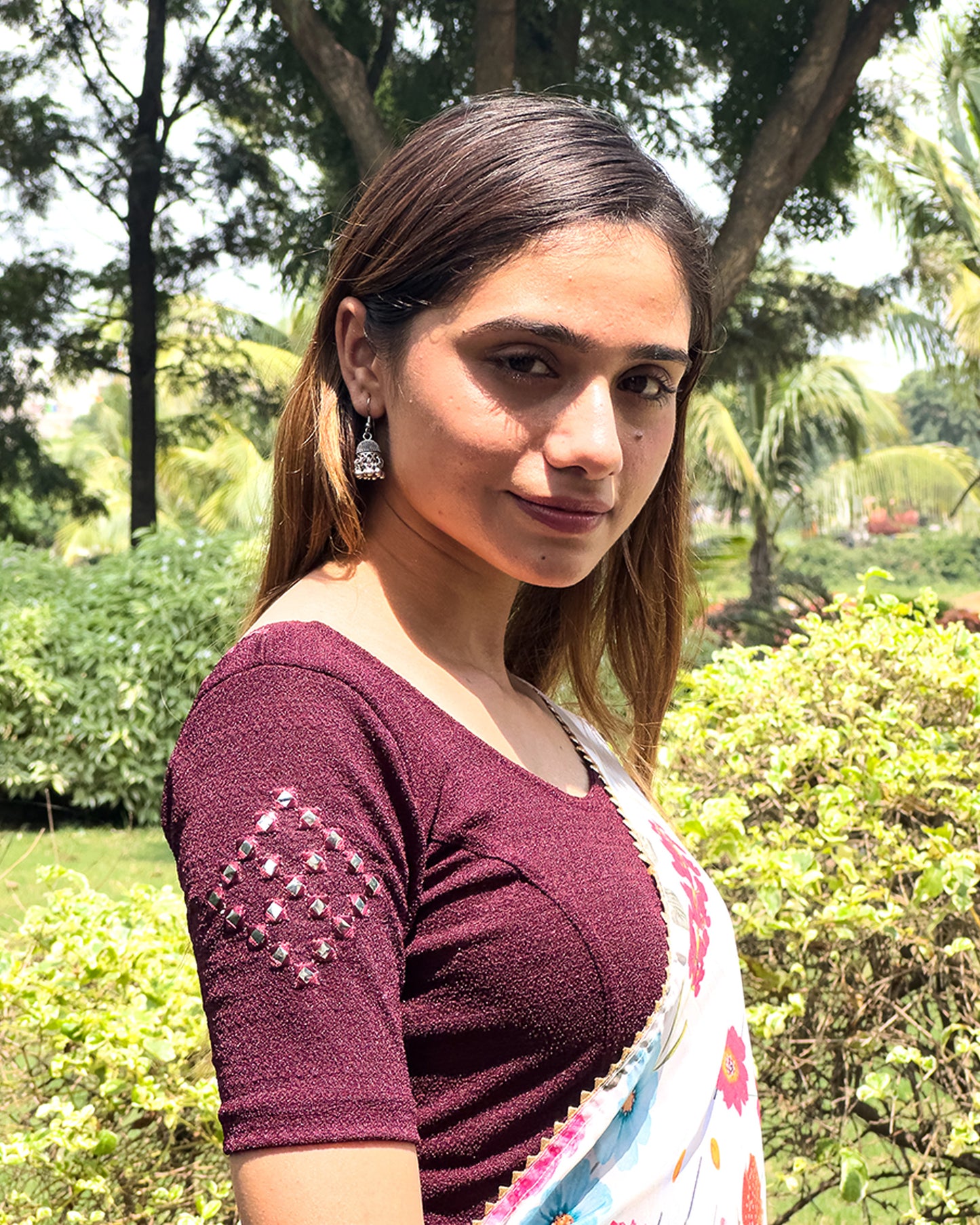 Model wearing the blouse with a saree for a festive ensemble ideal for Navratri.
