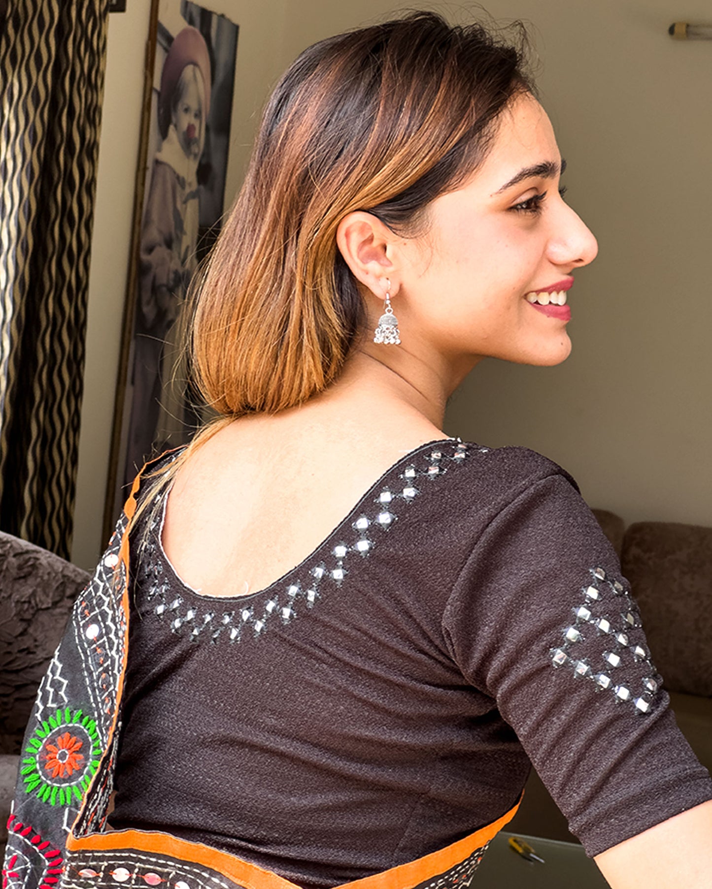 Close-up of jacquard knit with mirrored embroidery detailing.