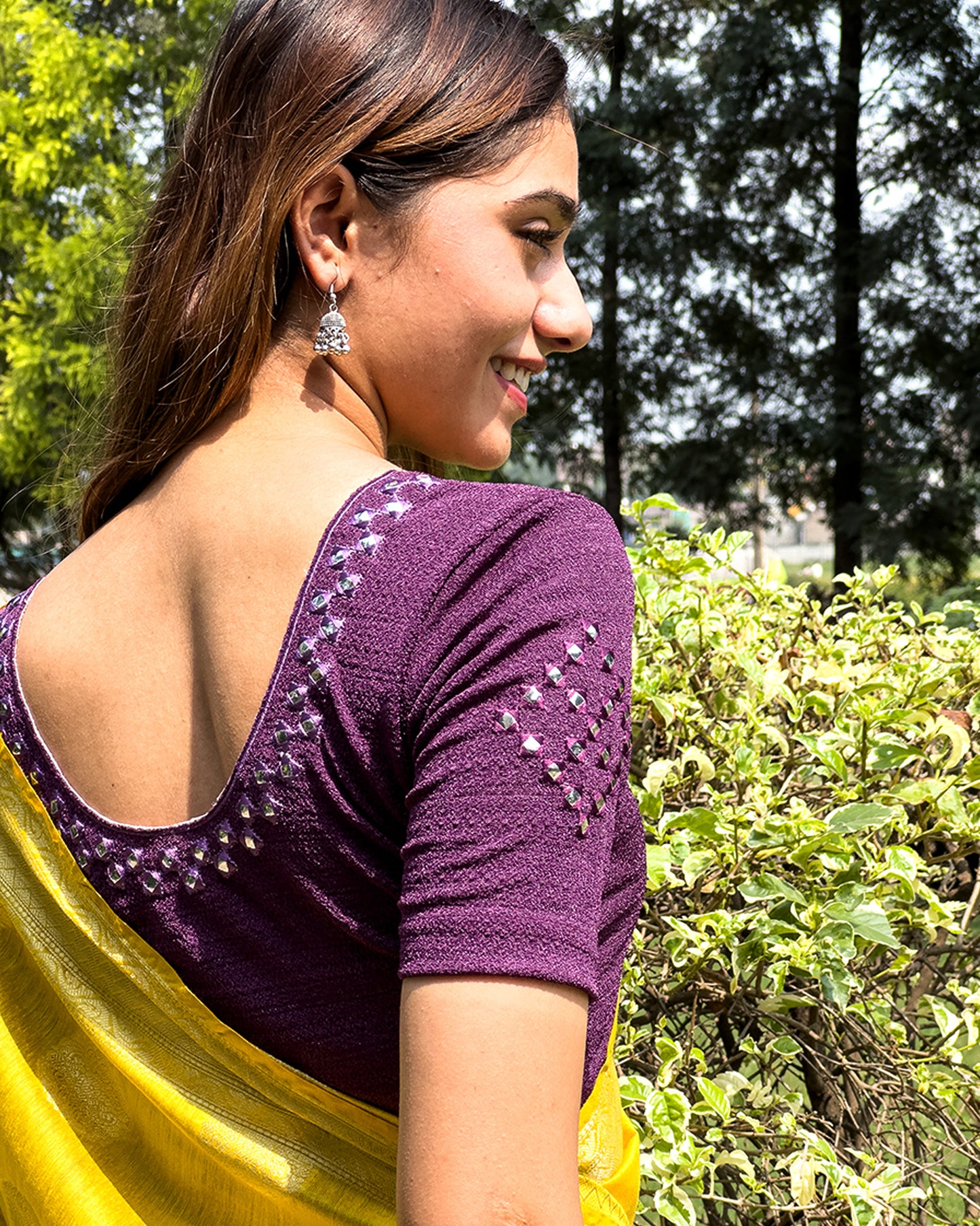 Rear view of the blouse showcasing the back design.