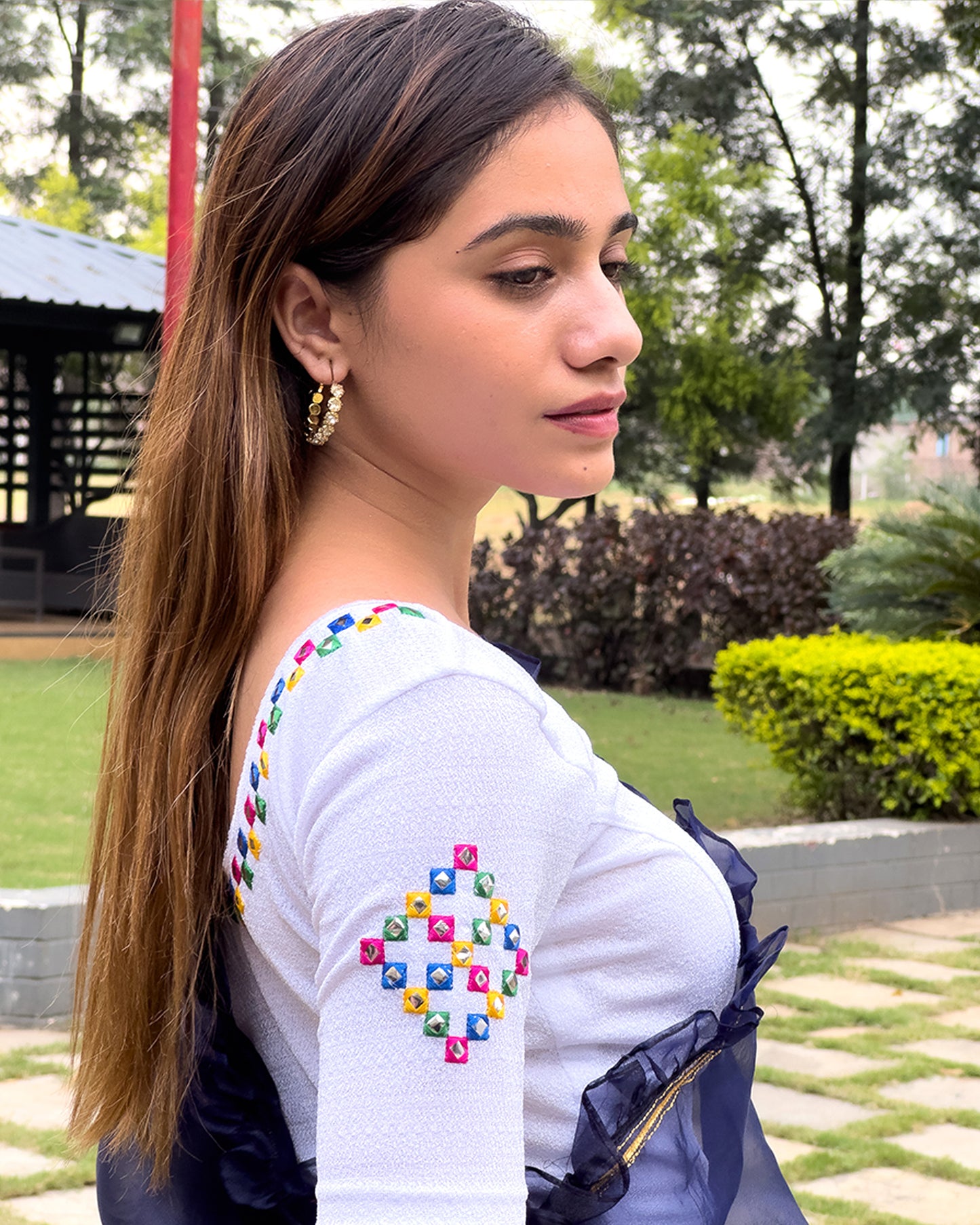 Side profile highlighting the sleeve shape and silhouette.