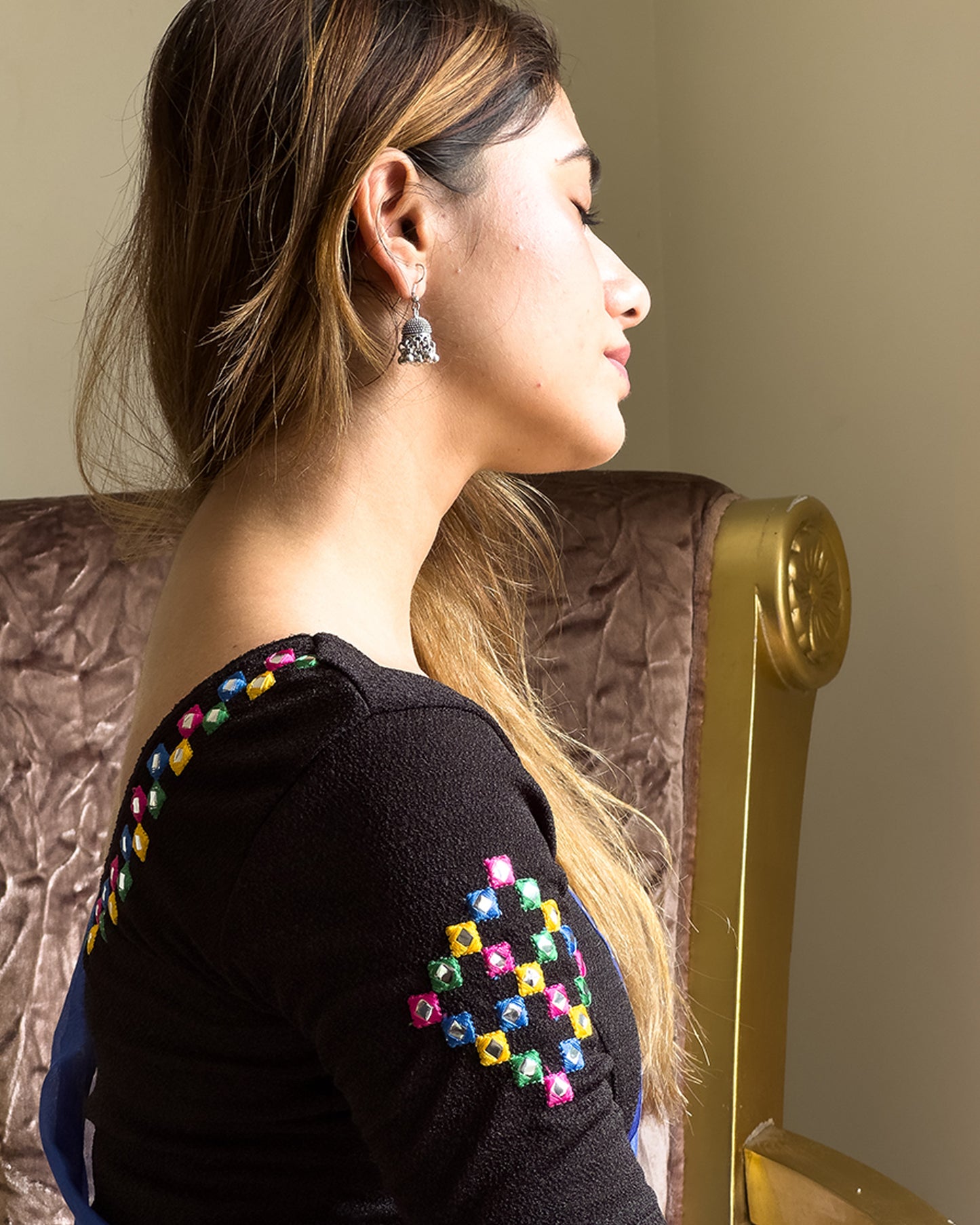 Side profile highlighting the sleeve shape and silhouette.