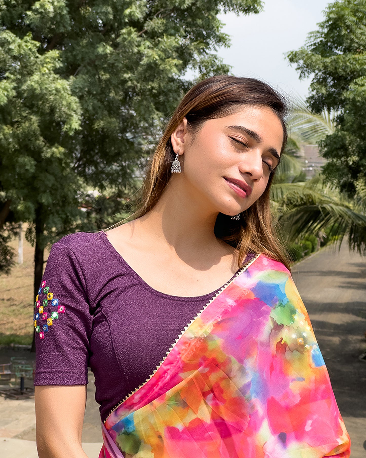 Model pairing the blouse with a saree, styled for festive occasions.