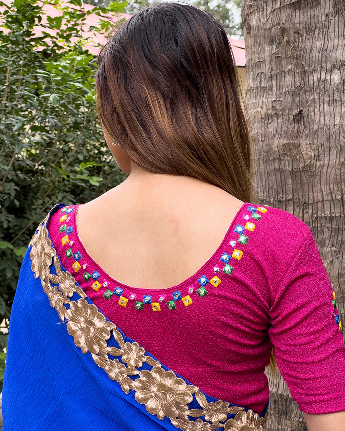Rear view showcasing the embroidered details and back fit.
