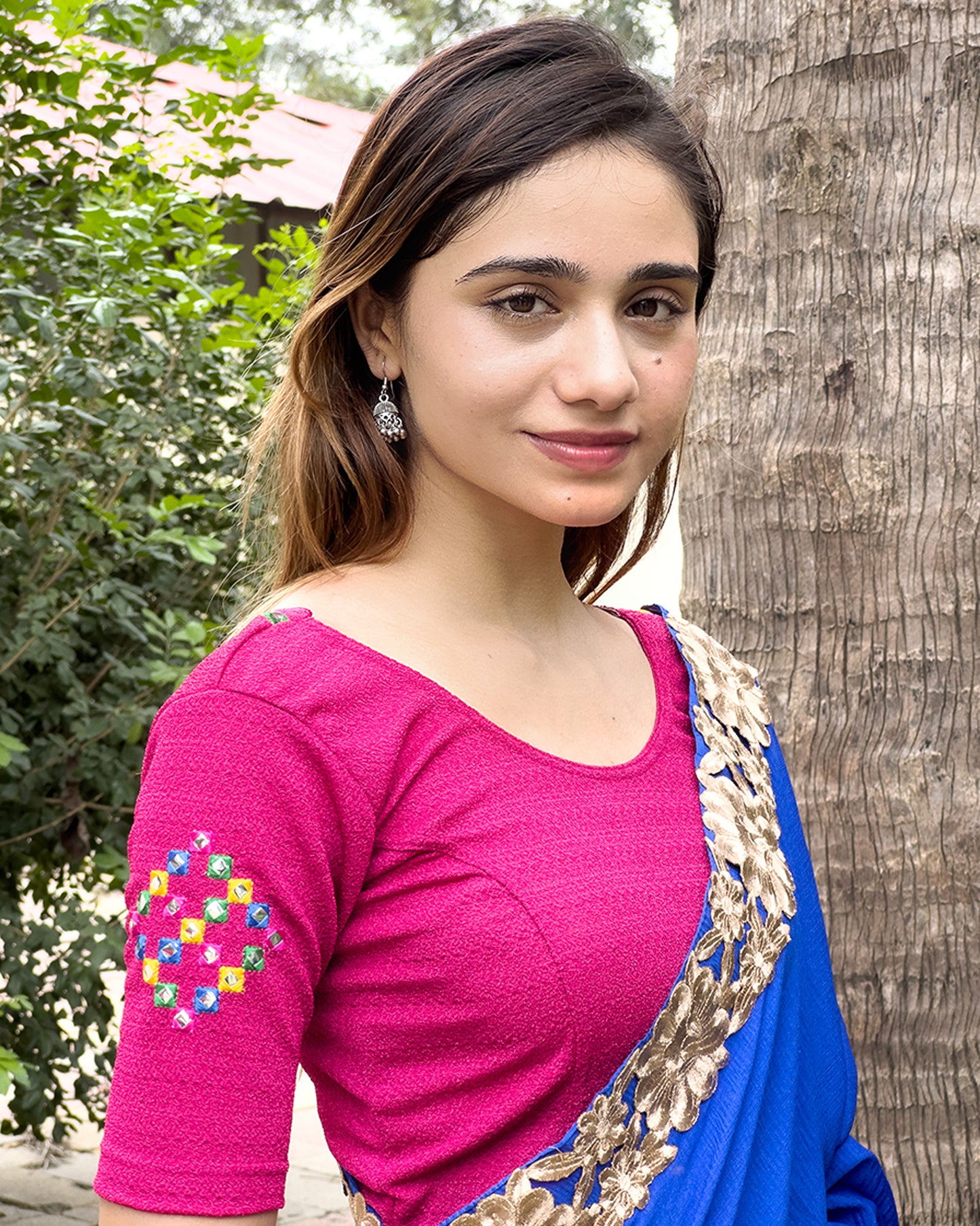 Model pairing the blouse with a saree, styled for festive occasions.