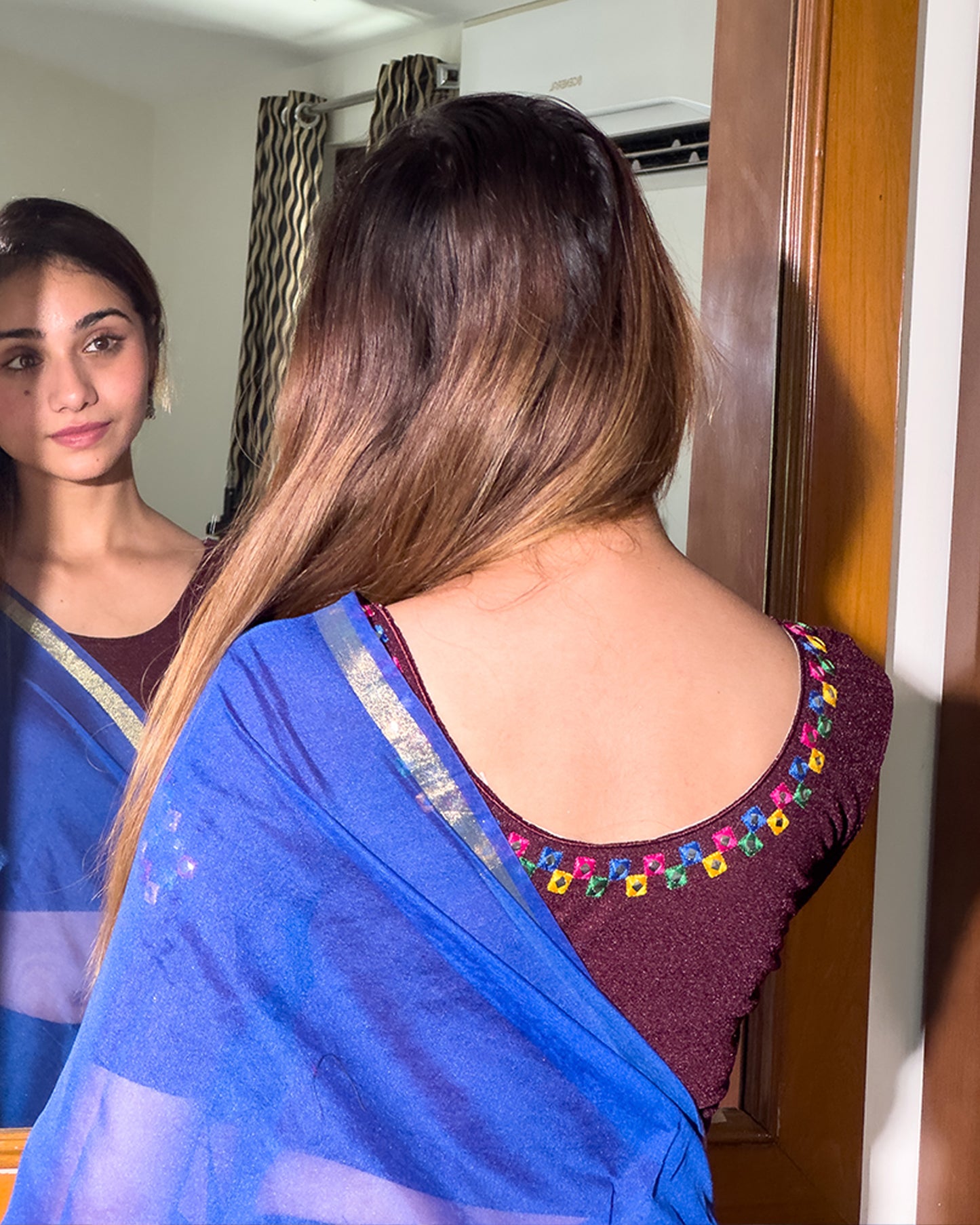 Rear view showcasing the embroidered details and back fit.