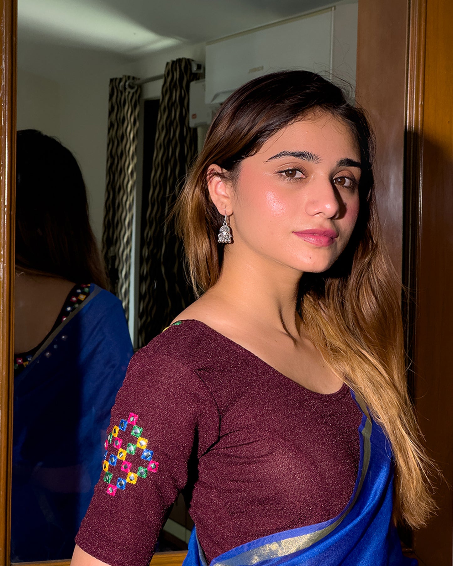 Model pairing the blouse with a saree, styled for festive occasions.
