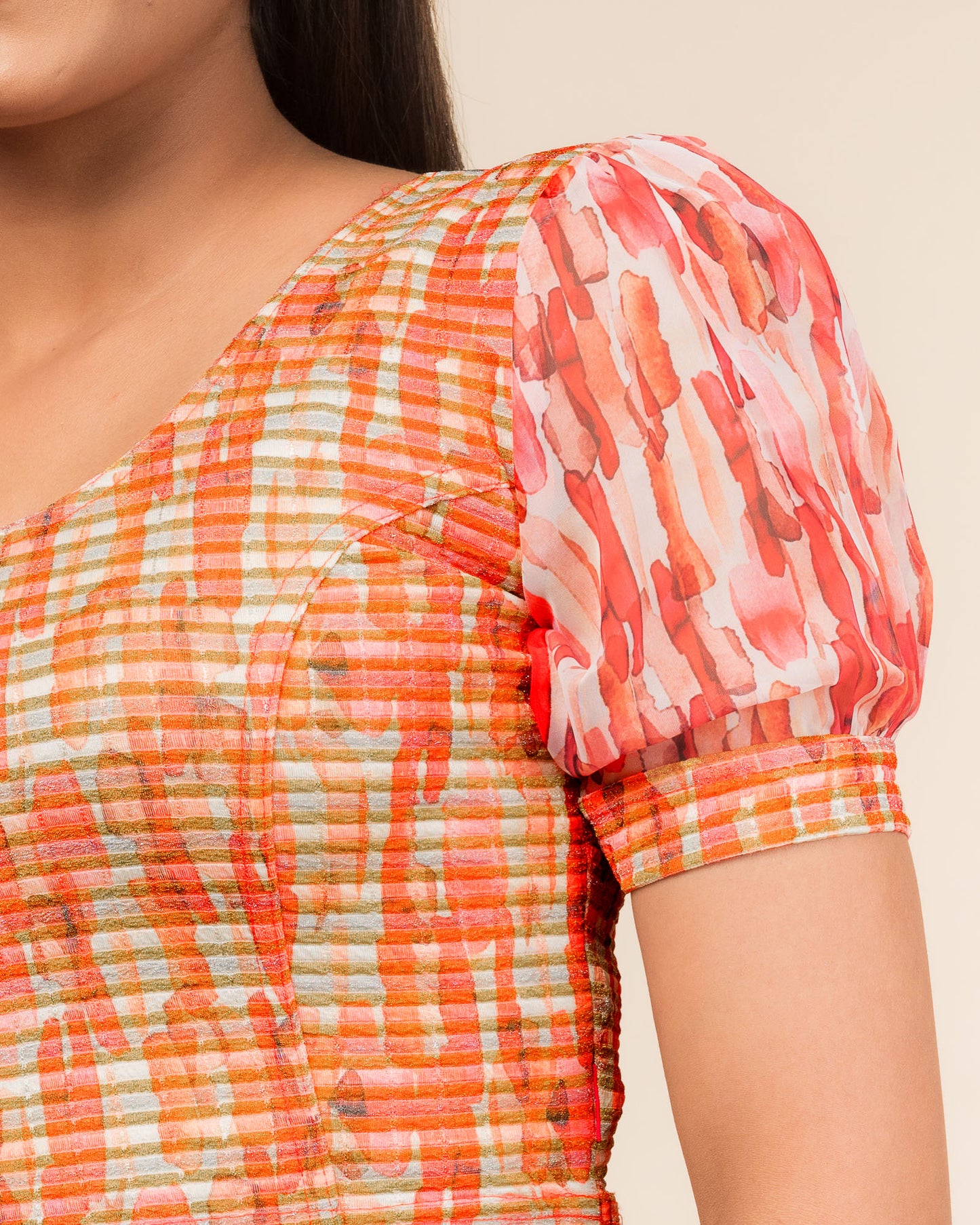 Close-up showing printed texture and sheer organza detail.