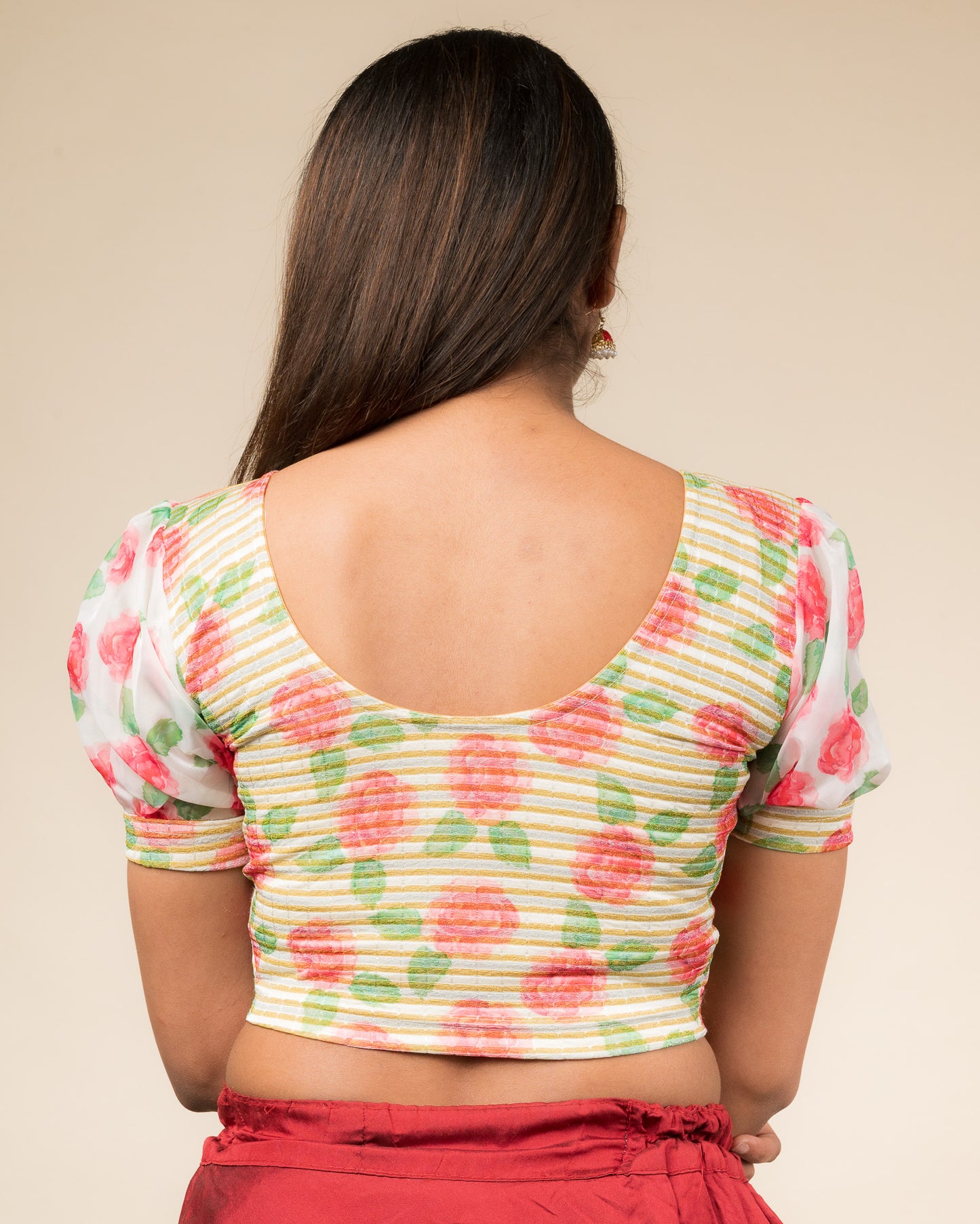Rear view showing the blouse’s printed back and organza sleeves.