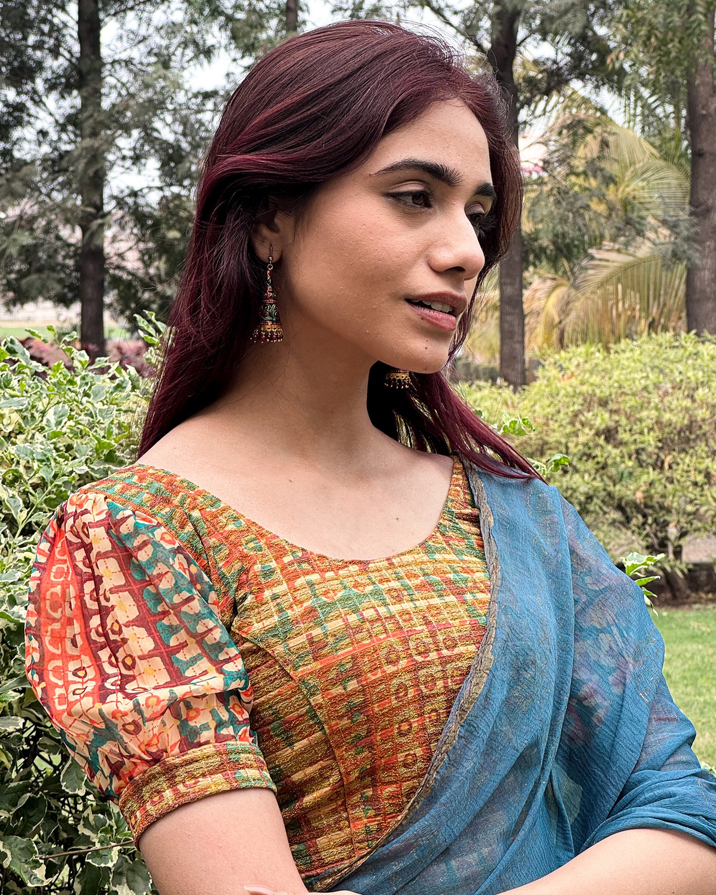 Model styled the blouse with a saree for a bold, festive look.