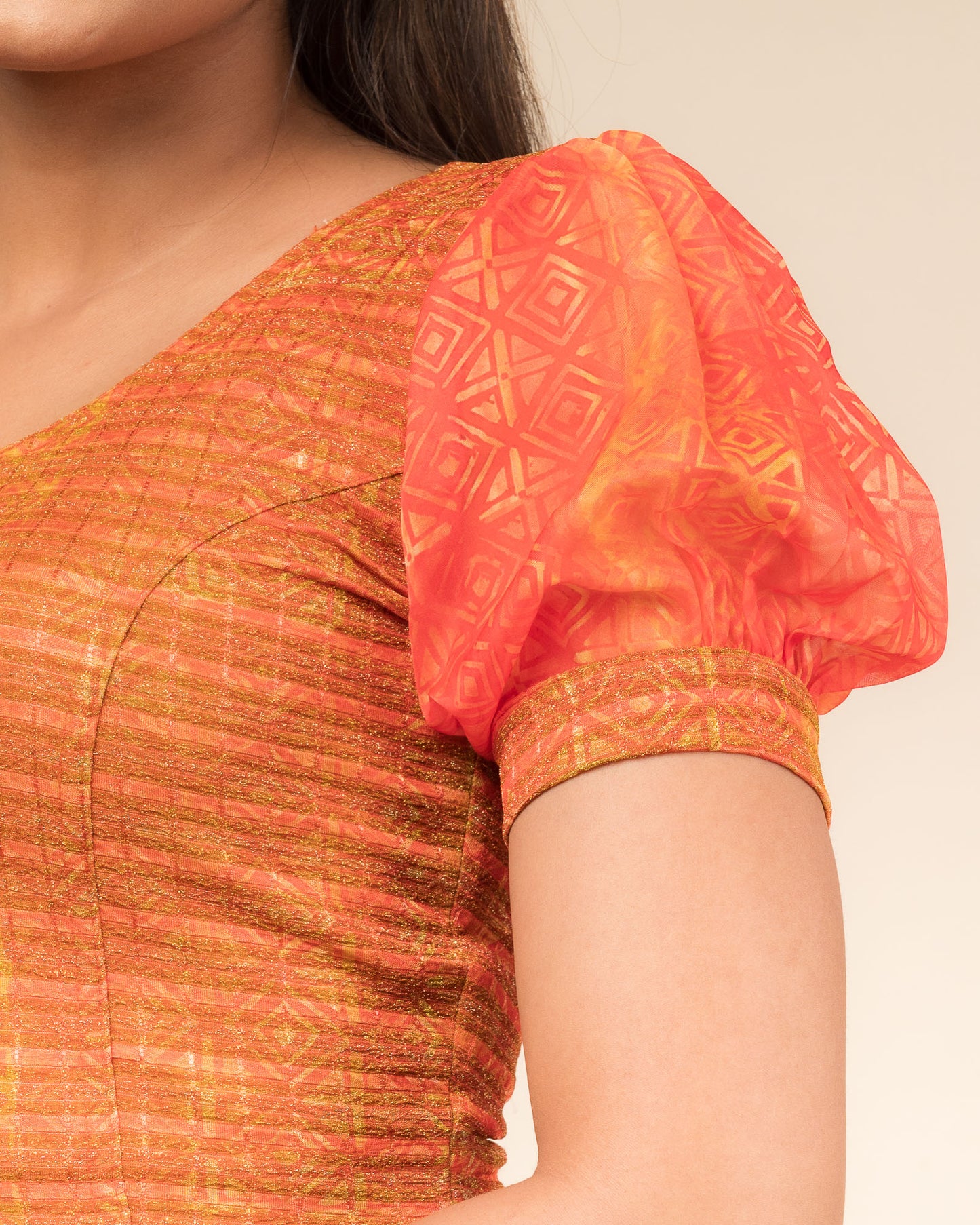 Close-up showing printed texture and sheer organza detail.