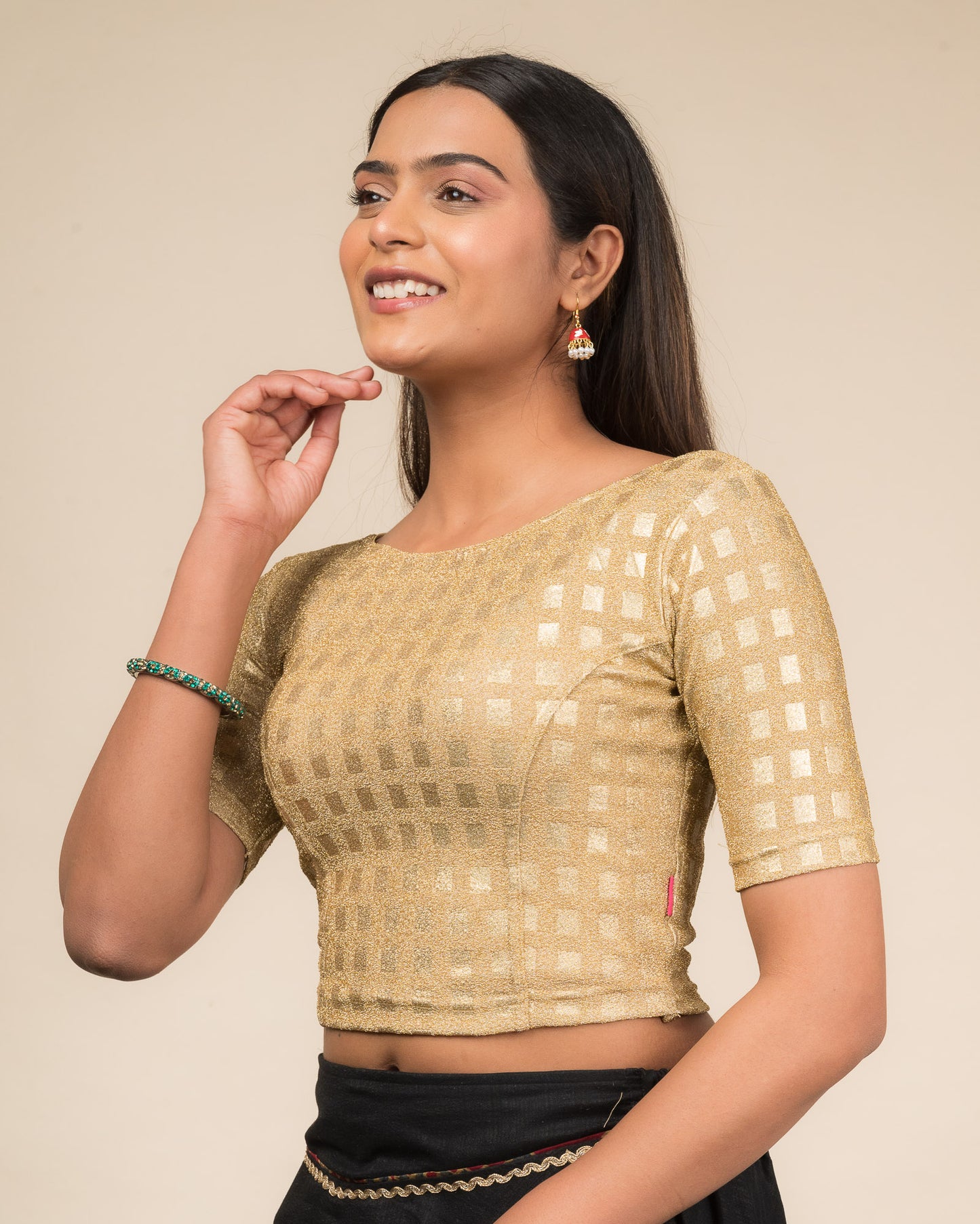 Side profile highlighting the silhouette and sleeve structure.