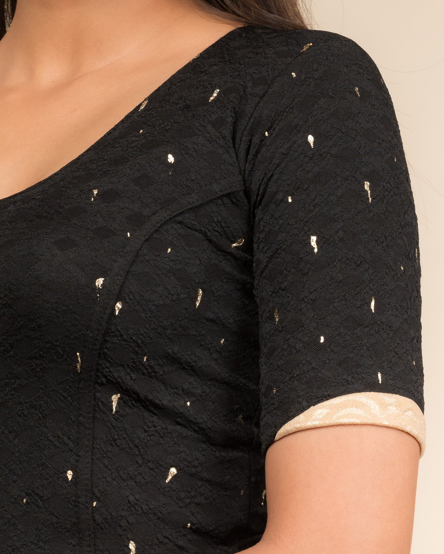 Close-up showing jacquard fabric with metallic drop accents