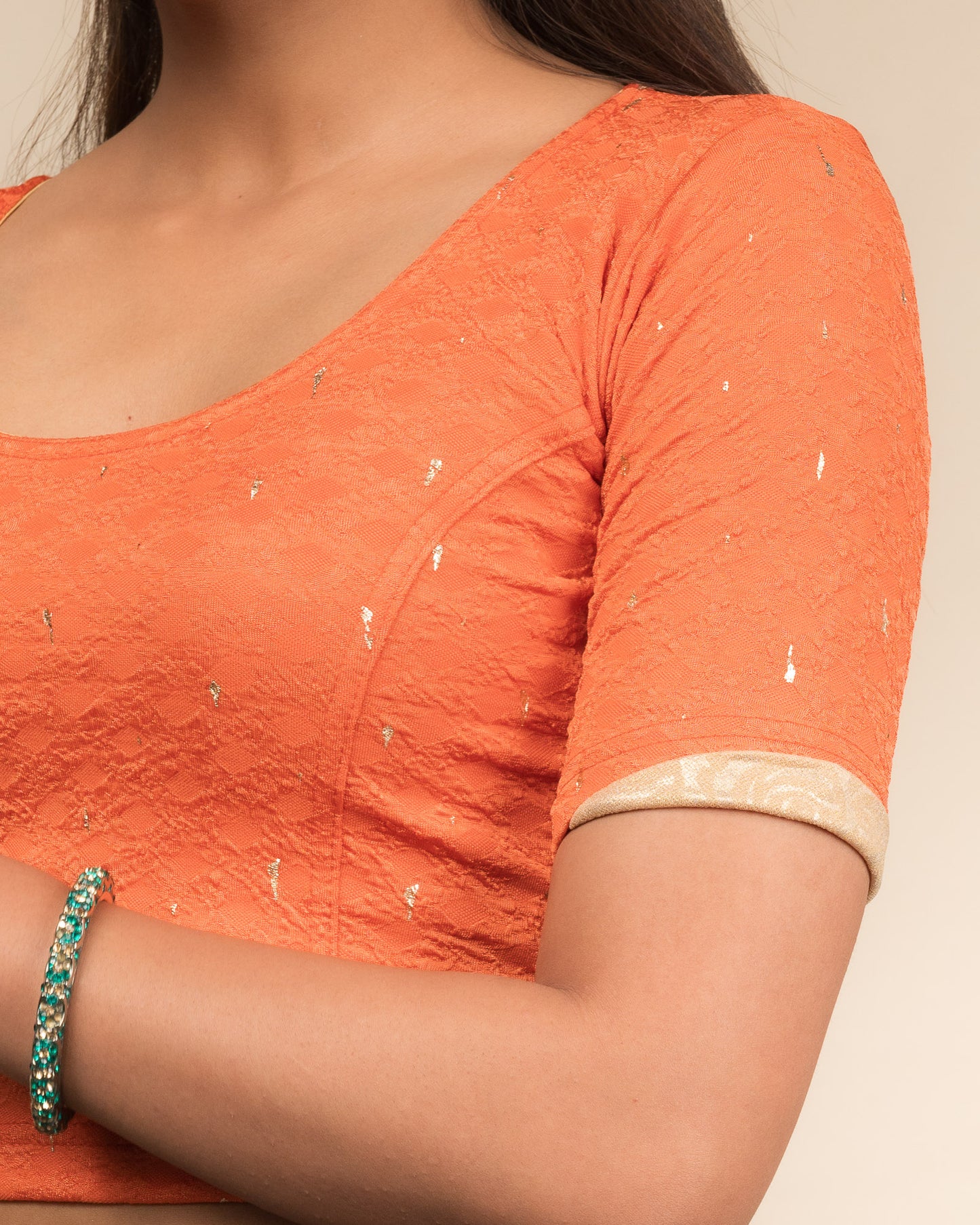 Close-up showing jacquard fabric with metallic drop accents.