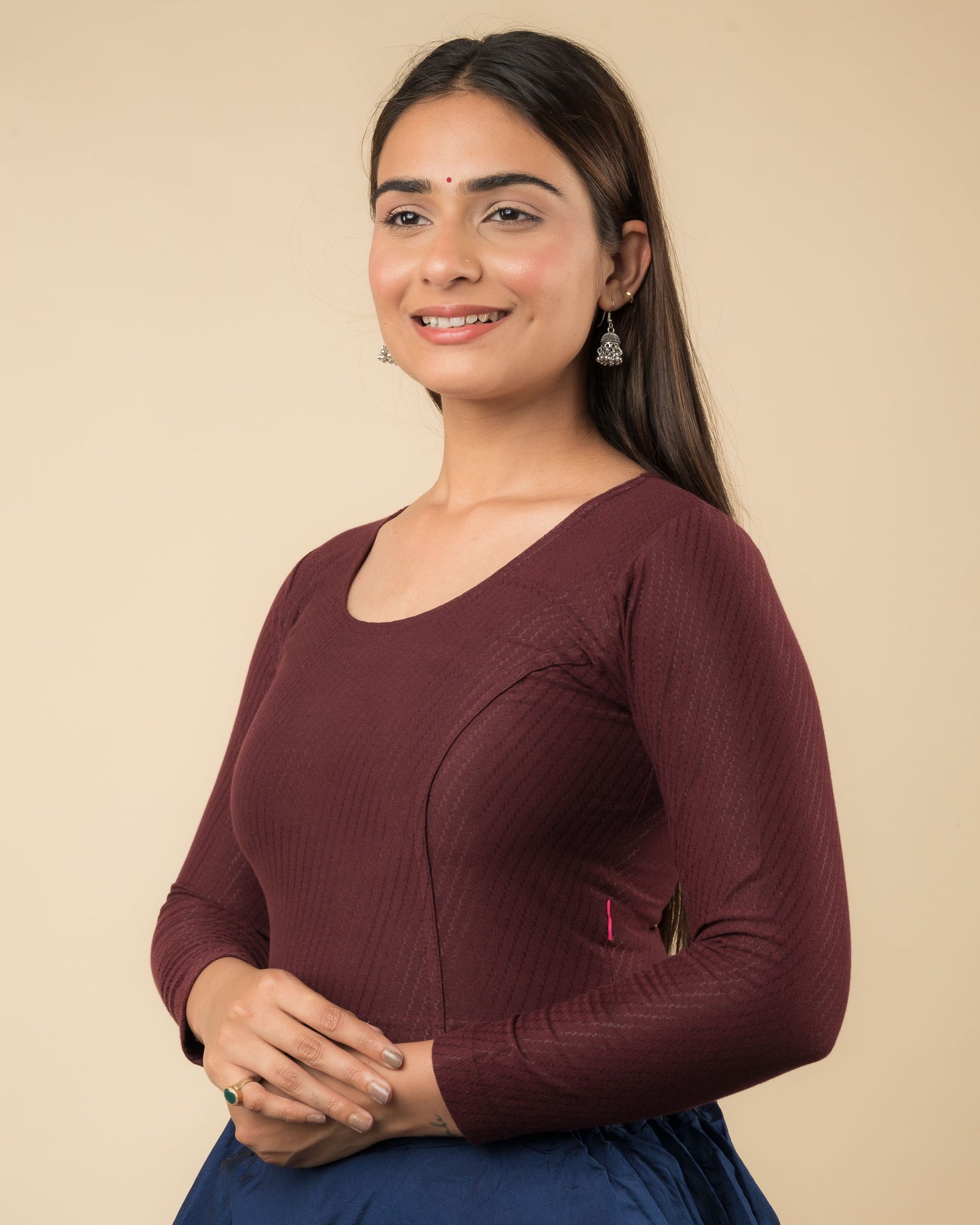 Side profile highlighting the sleeve length and silhouette