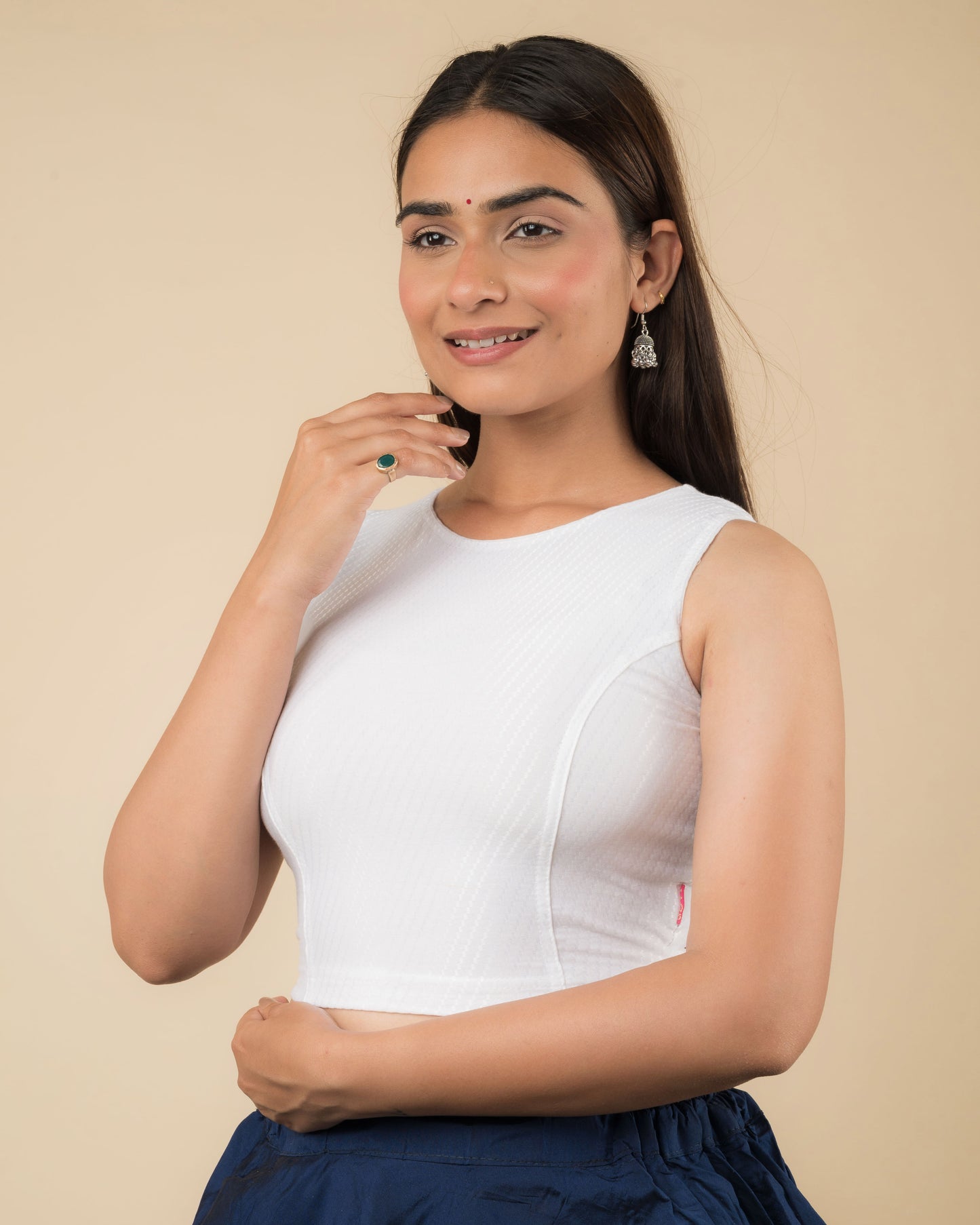Side profile highlighting the fit and high neckline
