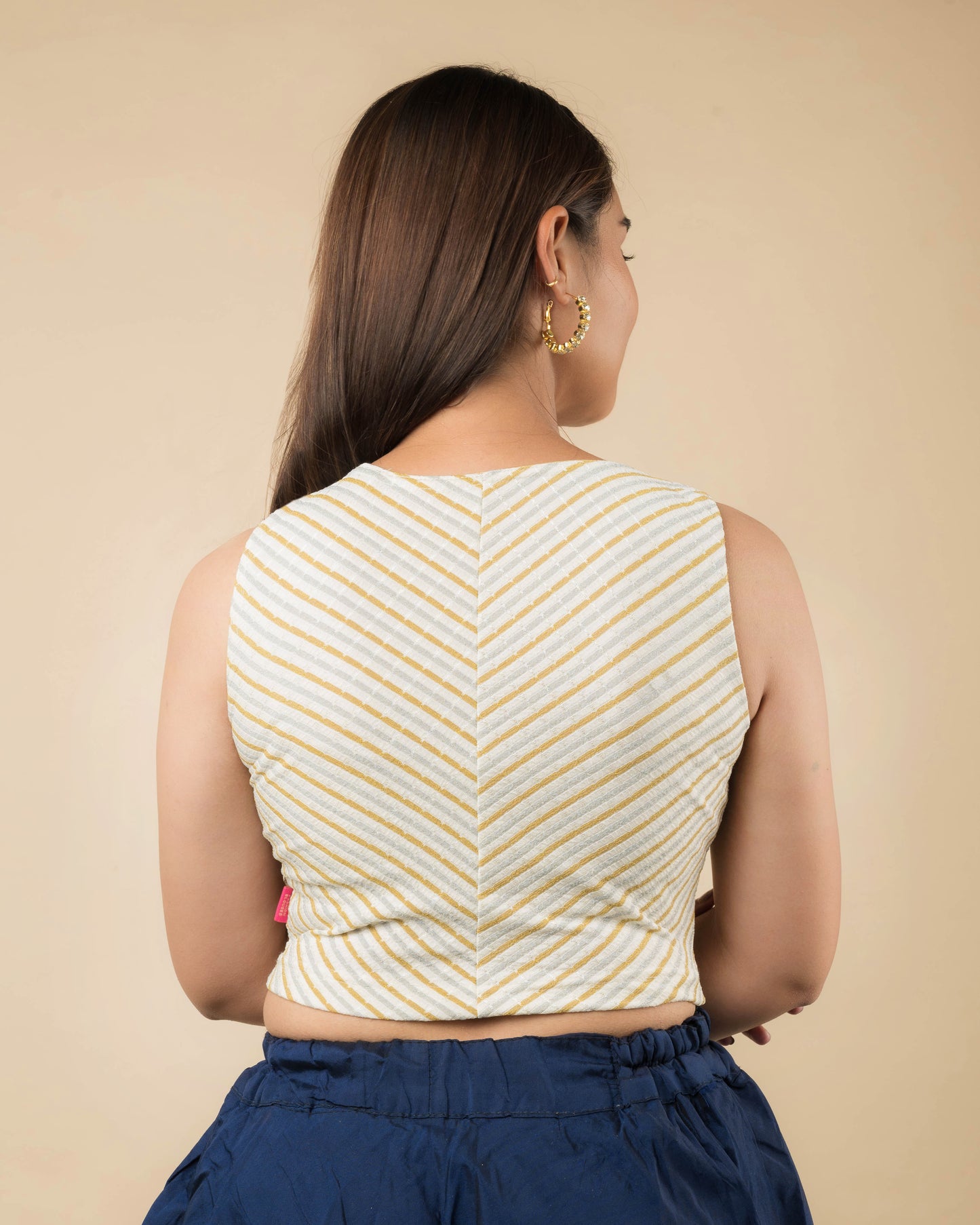 Dhara Cream Striped Boat Neck Stretchable Blouse by Advi